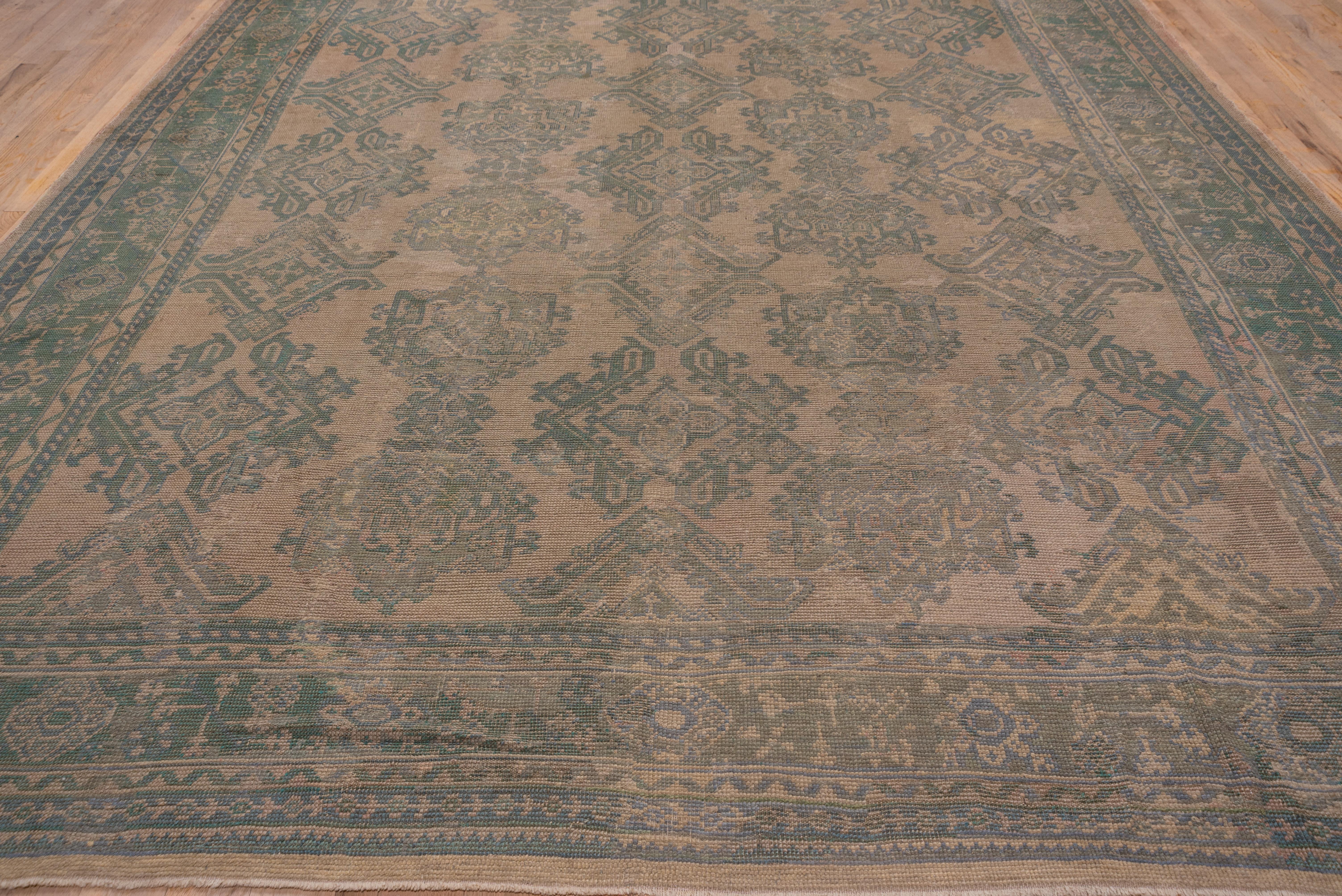 20th Century Light Brown and Green Antique Oushak Carpet, circa 1920s For Sale