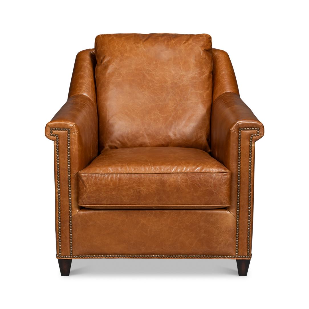 Upholstered in rich Cuba Brown leather, this chair is designed to make a statement. Its contrasting oak wood frame adds a touch of classic charm, while the nailhead trim along the edges provides refined detailing and sophistication.

Ideal for