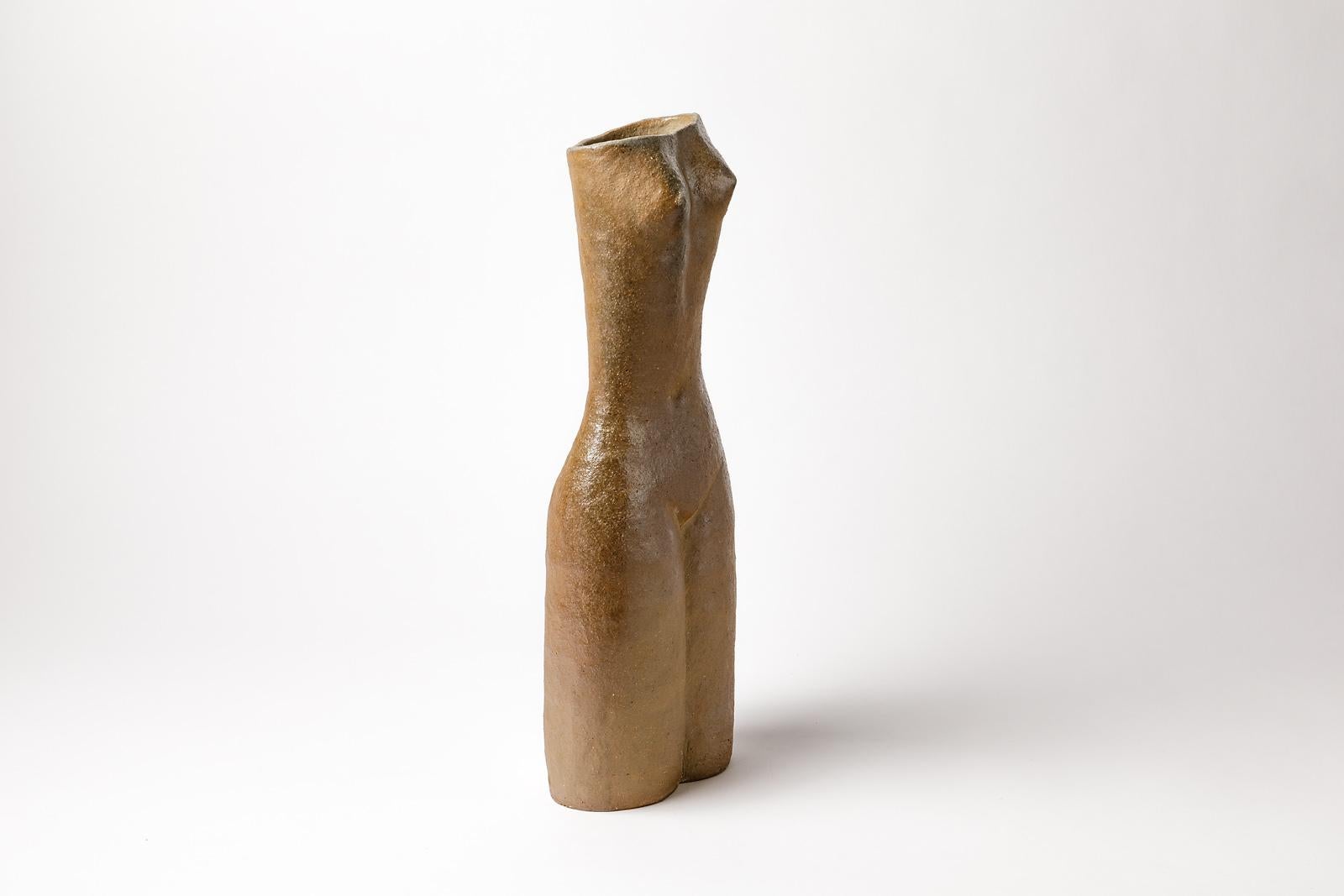 Martin Hammond

Midcentury design light brown stoneware ceramic vase.

Elegant form and wood fire kiln effects.

Signed at the base: MH

Possibility to make a couple of vase,

circa 1975

Measures: Height 41 cm, large 16 cm, depth 9 cm.