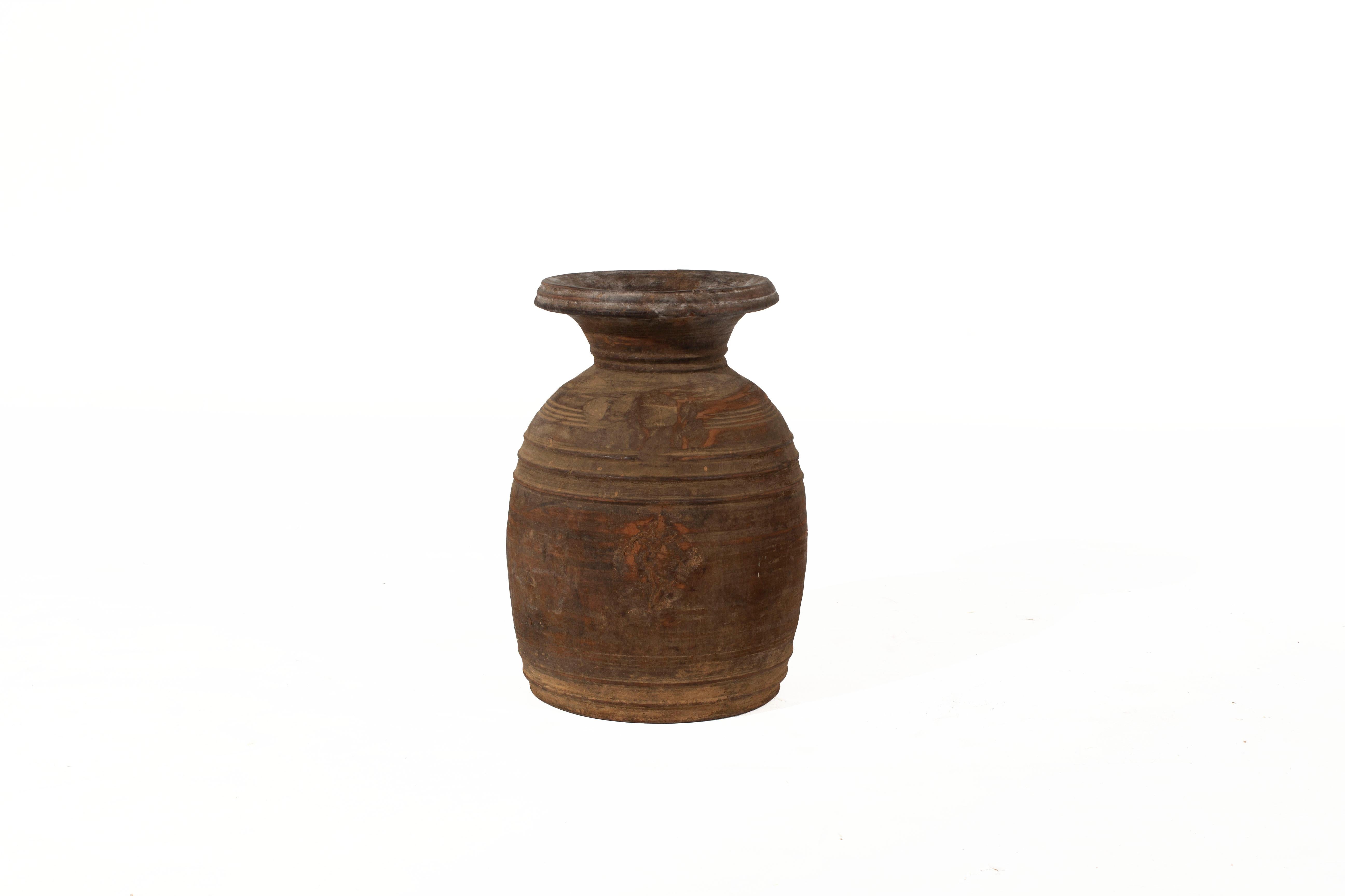 Light brown storage jar.

Jars vary in markings. No two jars are identical.