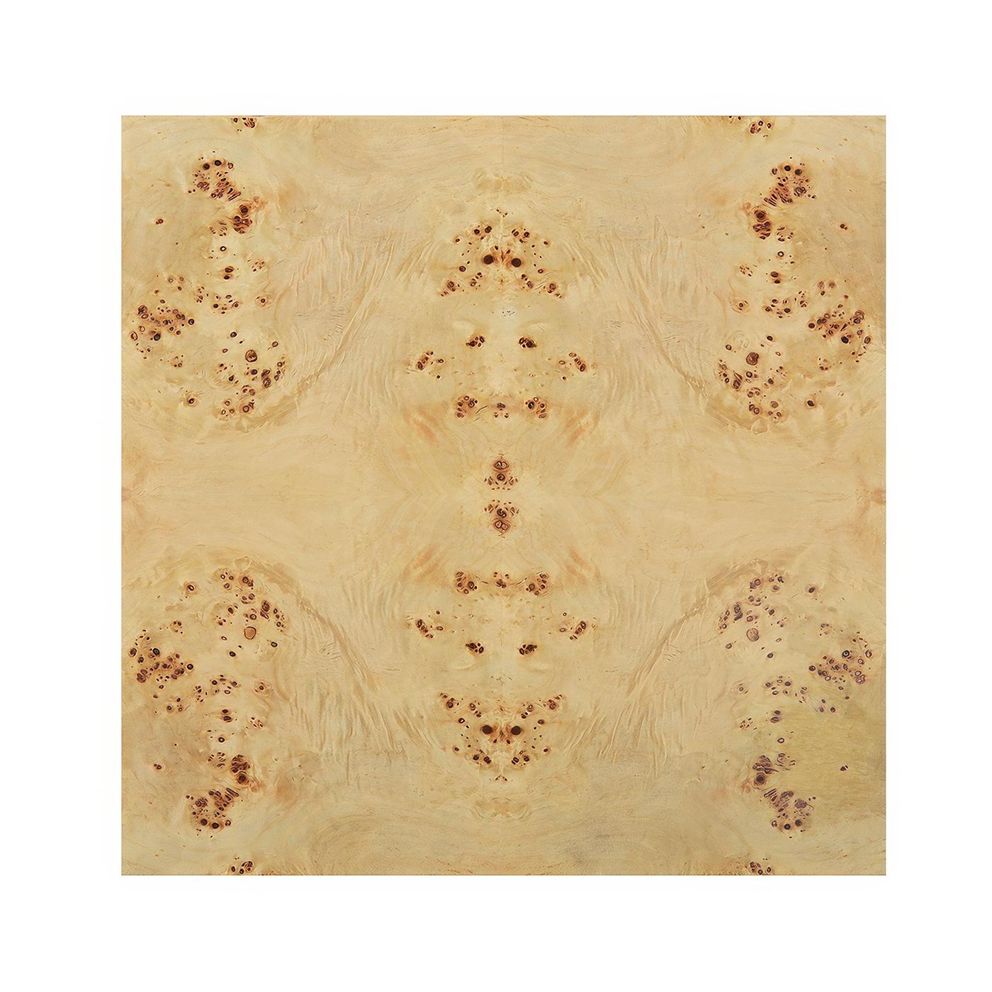 Crafted from luxurious clear polished mappa burl wood veneer, this table showcases its unique grain patterns. The minimalist waterfall design is elevated with brass accents at the base, adding a modern touch to its timeless aesthetic.

Perfect for