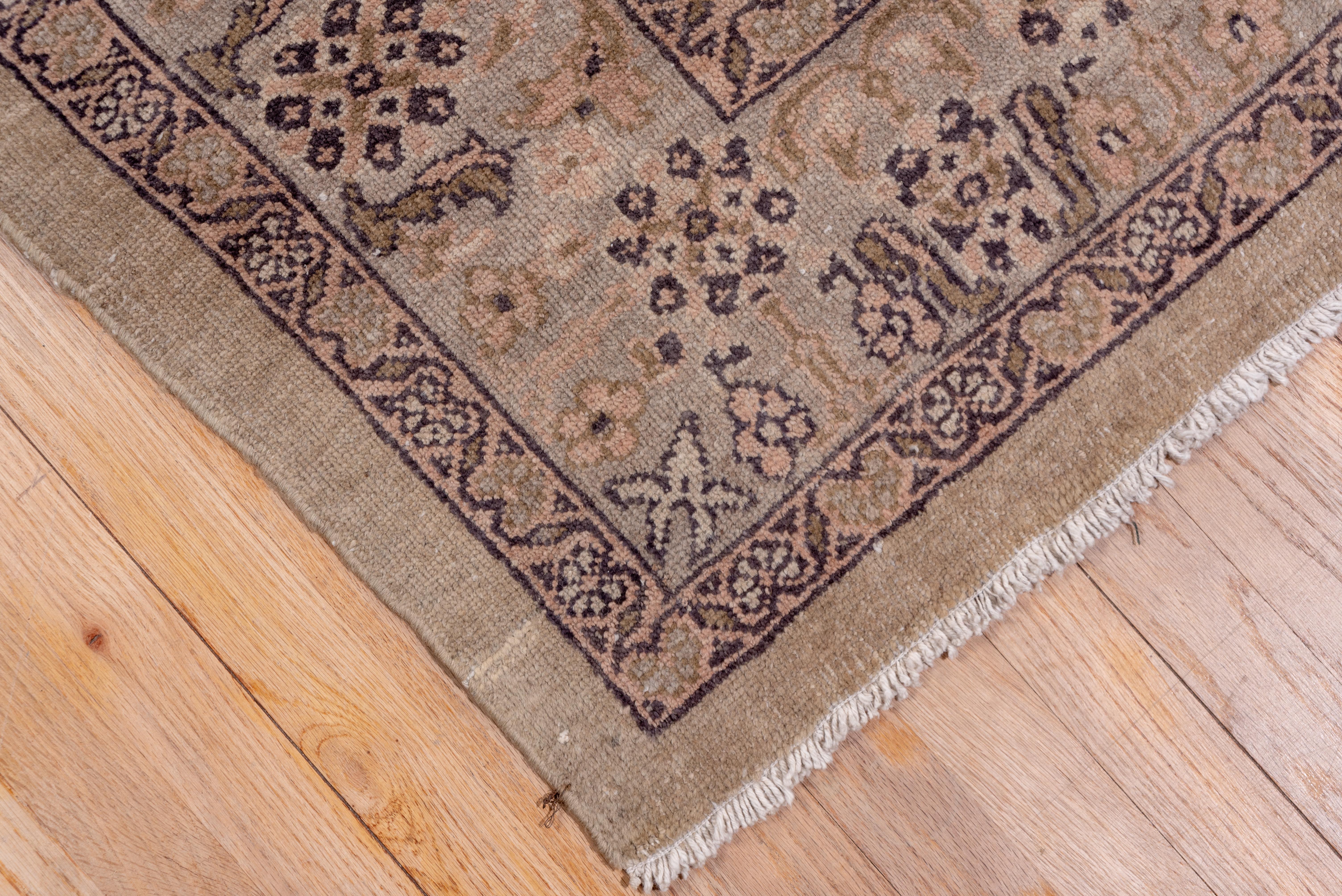 Light colored as most east Anatolian Sivas rugs are, this city carpet features a beige-grounded cartouche, lozenge lattice enclosing multi-flower plants, simple palmettes and equally simple leaves. Eight petal rosettes switch back and forth in the