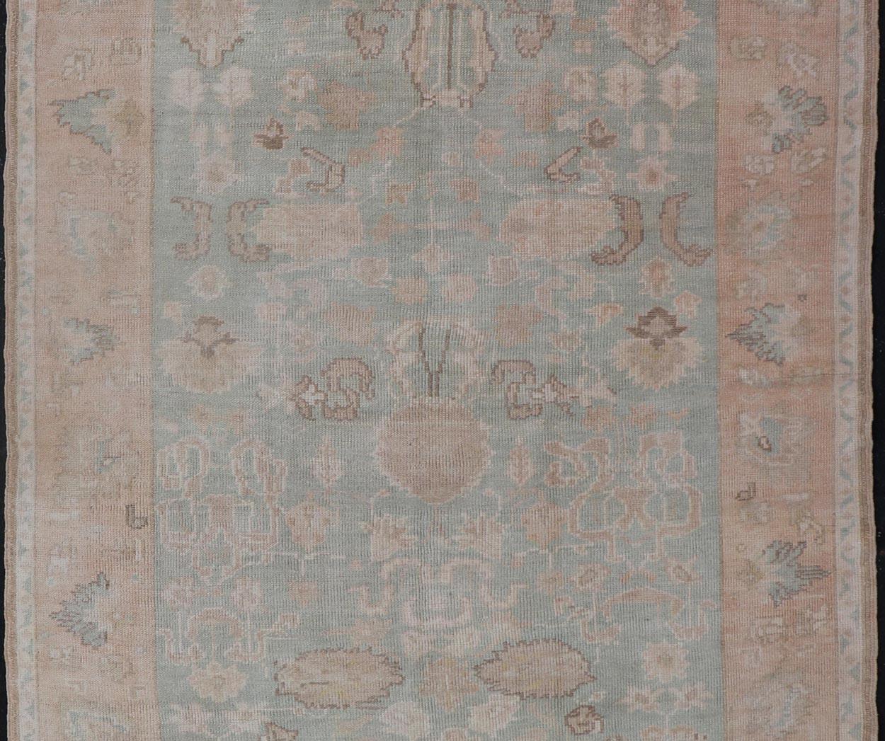 Wool Light Colored Turkish Vintage Oushak Rug with All-Over Design in Light Green For Sale