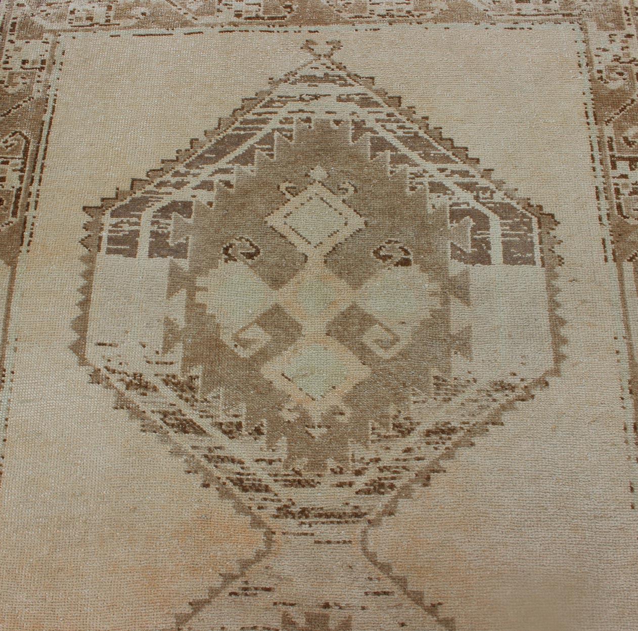 Wool Light Colored Vintage Oushak Gallery Runner with Geometric Medallions For Sale