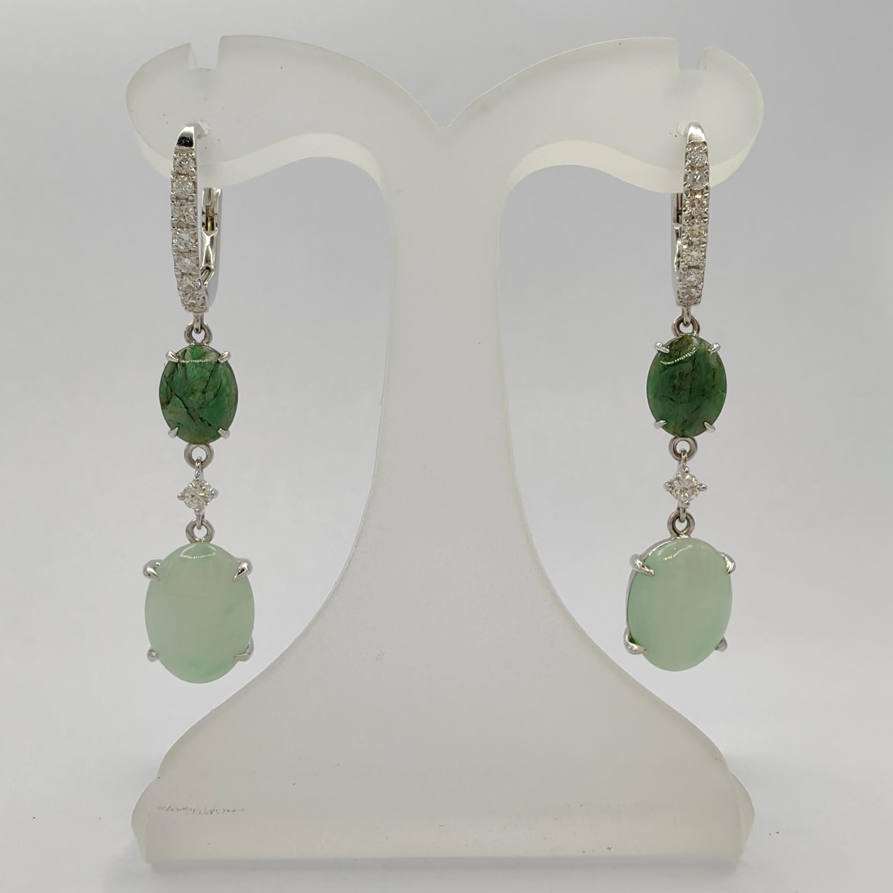 Introducing our captivating Light & Deep Green Burmese Jadeite Jade Diamond Dangling Earrings in 18K Gold, a mesmerizing display of elegance and sophistication. The unique design of these earrings features 14 diamonds on lever backs, elegantly