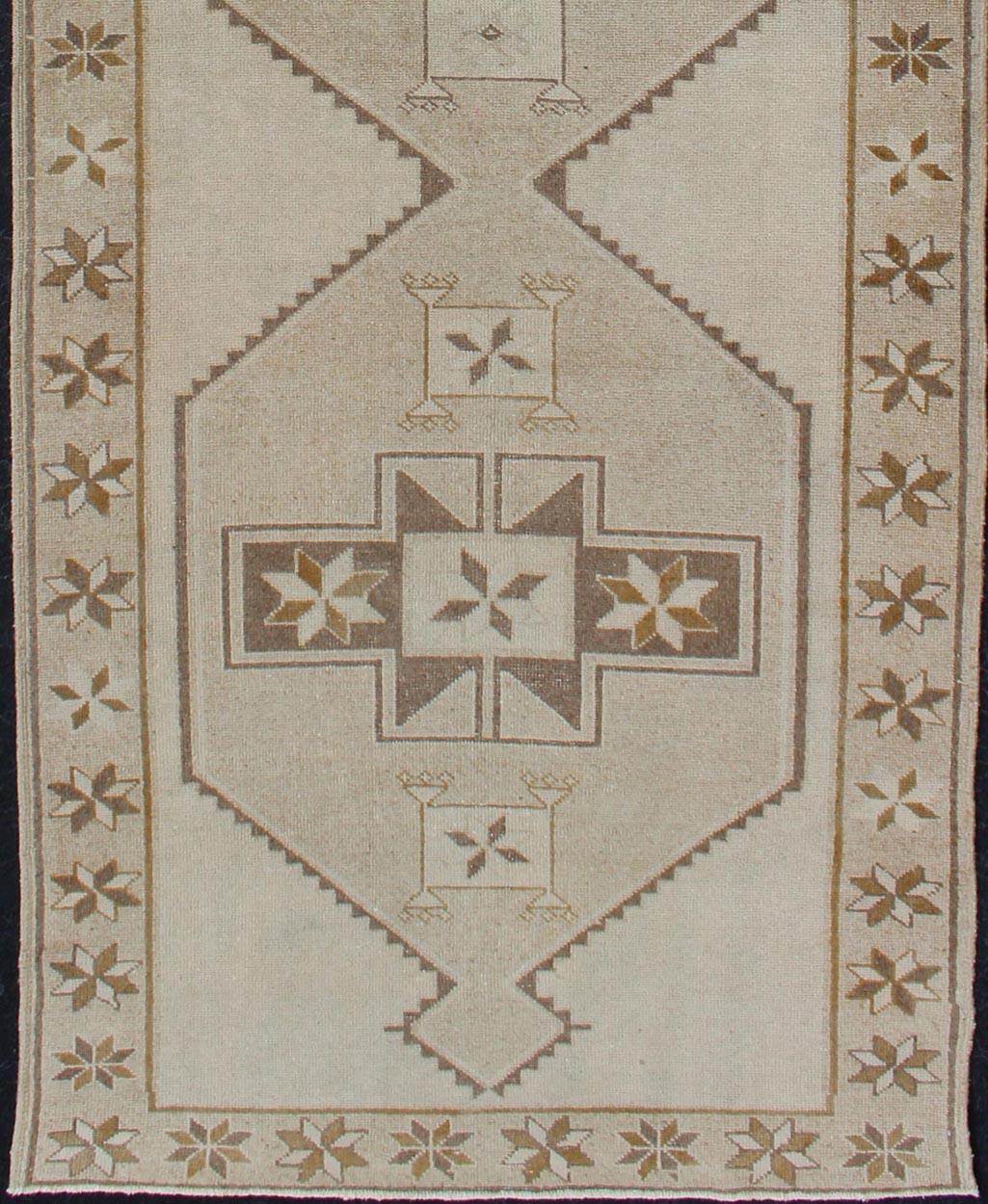Turkish Light Gallery Vintage Oushak Runner with Geometric Medallions in Brown and Taupe For Sale