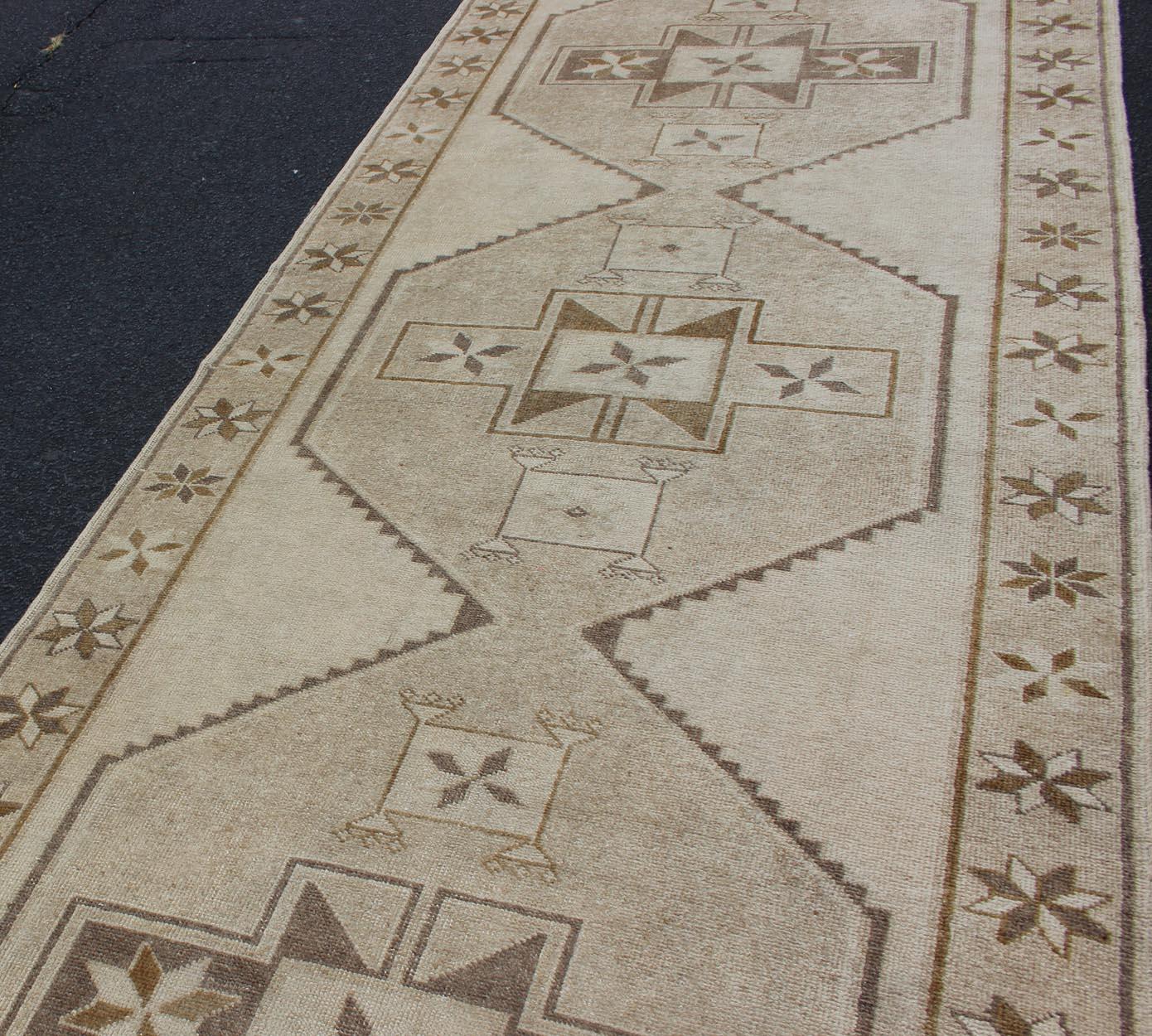 Hand-Knotted Light Gallery Vintage Oushak Runner with Geometric Medallions in Brown and Taupe For Sale