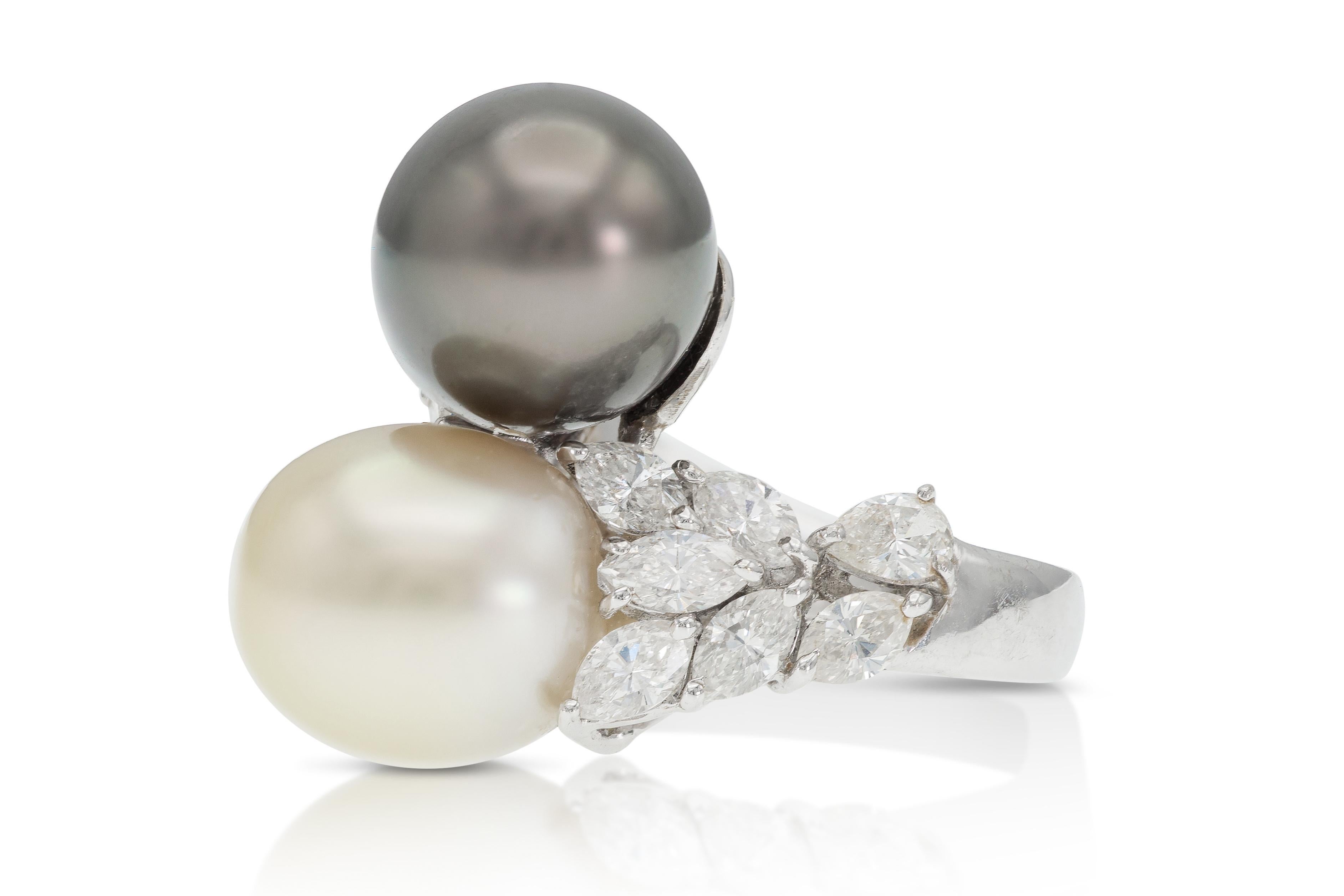 Finely crafted in platinum with one Light Gold South Sea Pearl and one Tahitian Pearl, both measuring 11.5-12mm, and Marquise and Pear-Shaped Diamonds weighing approximately 2.80 carats.
Size 6 1/2, resizable