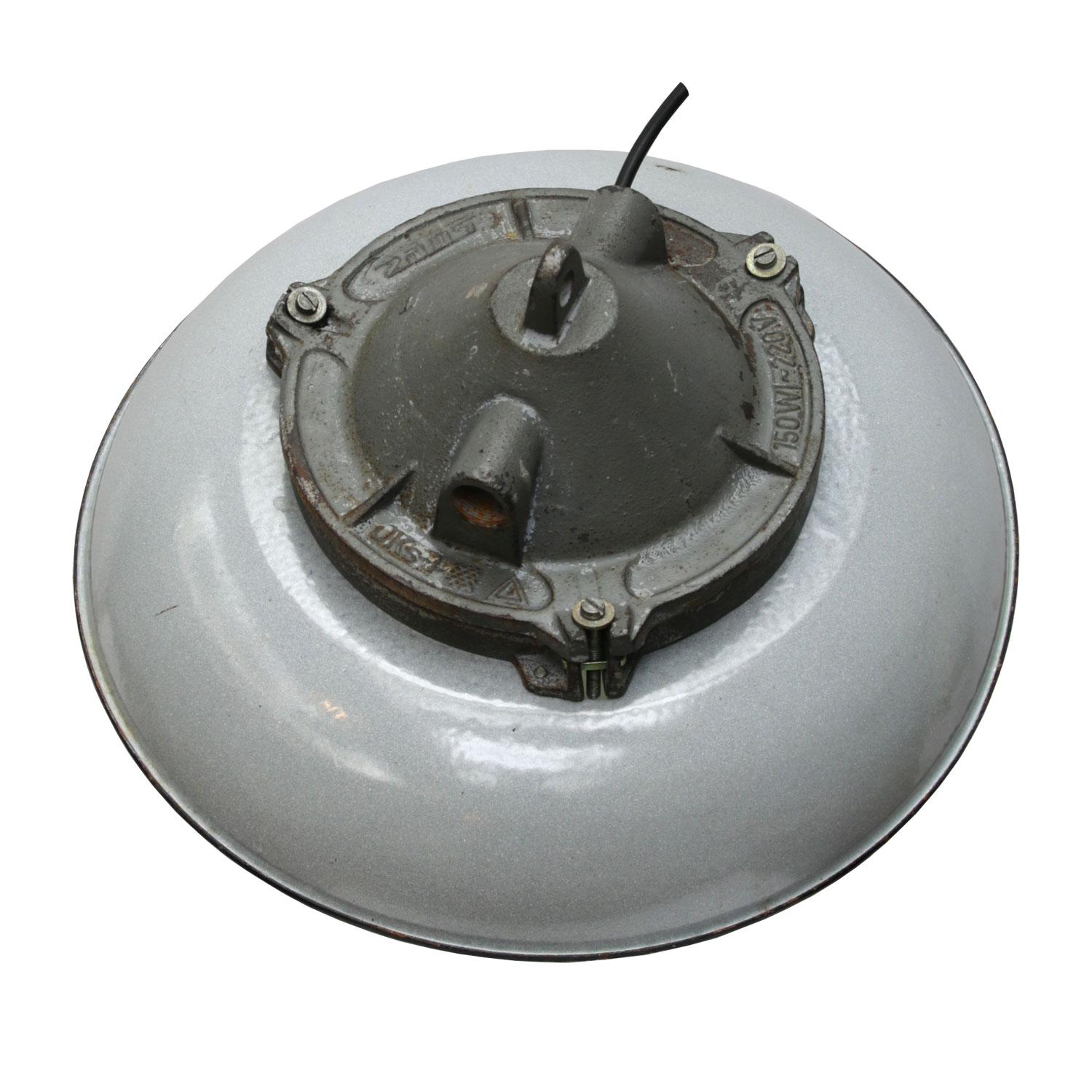 Industrial factory pendant. Grey enamel shade. Cast iron top. Holophane glass.

Weight 6.0 kg / 13.2 lb. 

Priced per individual item. All lamps have been made suitable by international standards for incandescent light bulbs, energy-efficient