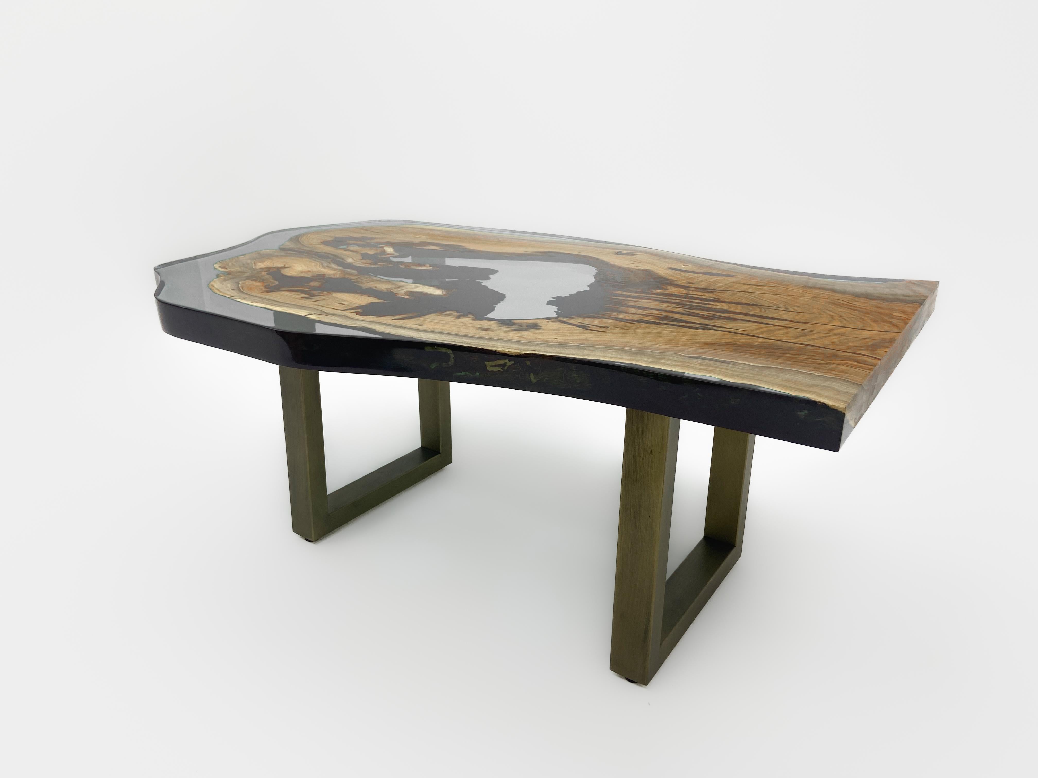 Light Gray Walnut Epoxy Coffee Table

Handcrafted by skilled artisans of Tinella Team, this coffee table seamlessly fuses natural wood with smoke epoxy resin, creating a captivating piece that captures nature's beauty. 
Its exceptional design and