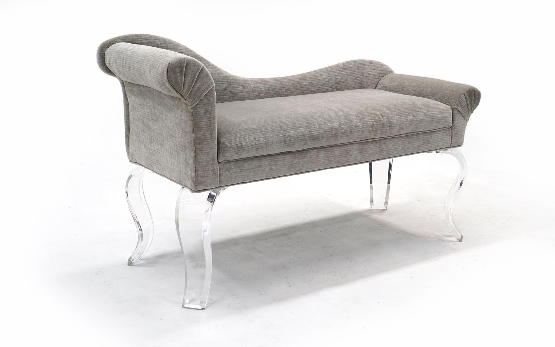 Curved back and arm sculptural recamier / love seat in new light gray upholstery. Thick substantial lucite legs. Very sturdy and in great condition.