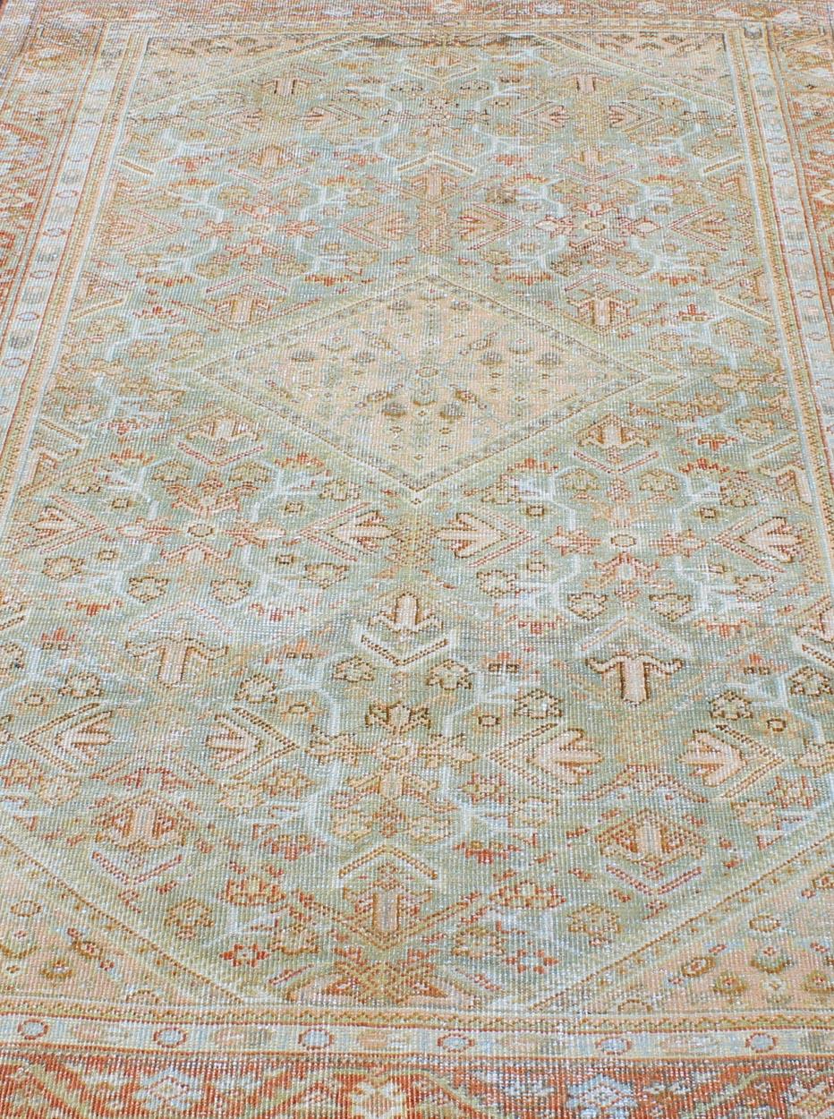 Wool Light Green and Red Antique Persian Mahal Rug with Peach Medallion Design For Sale