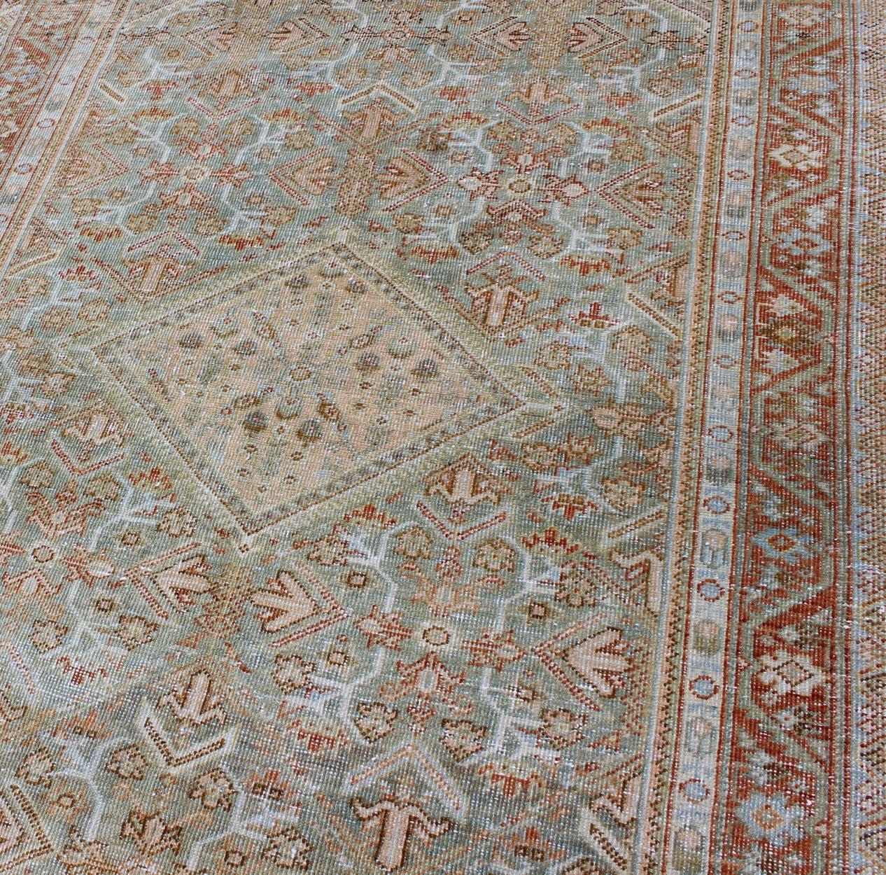 Early 20th Century Light Green and Red Antique Persian Mahal Rug with Peach Medallion Design For Sale
