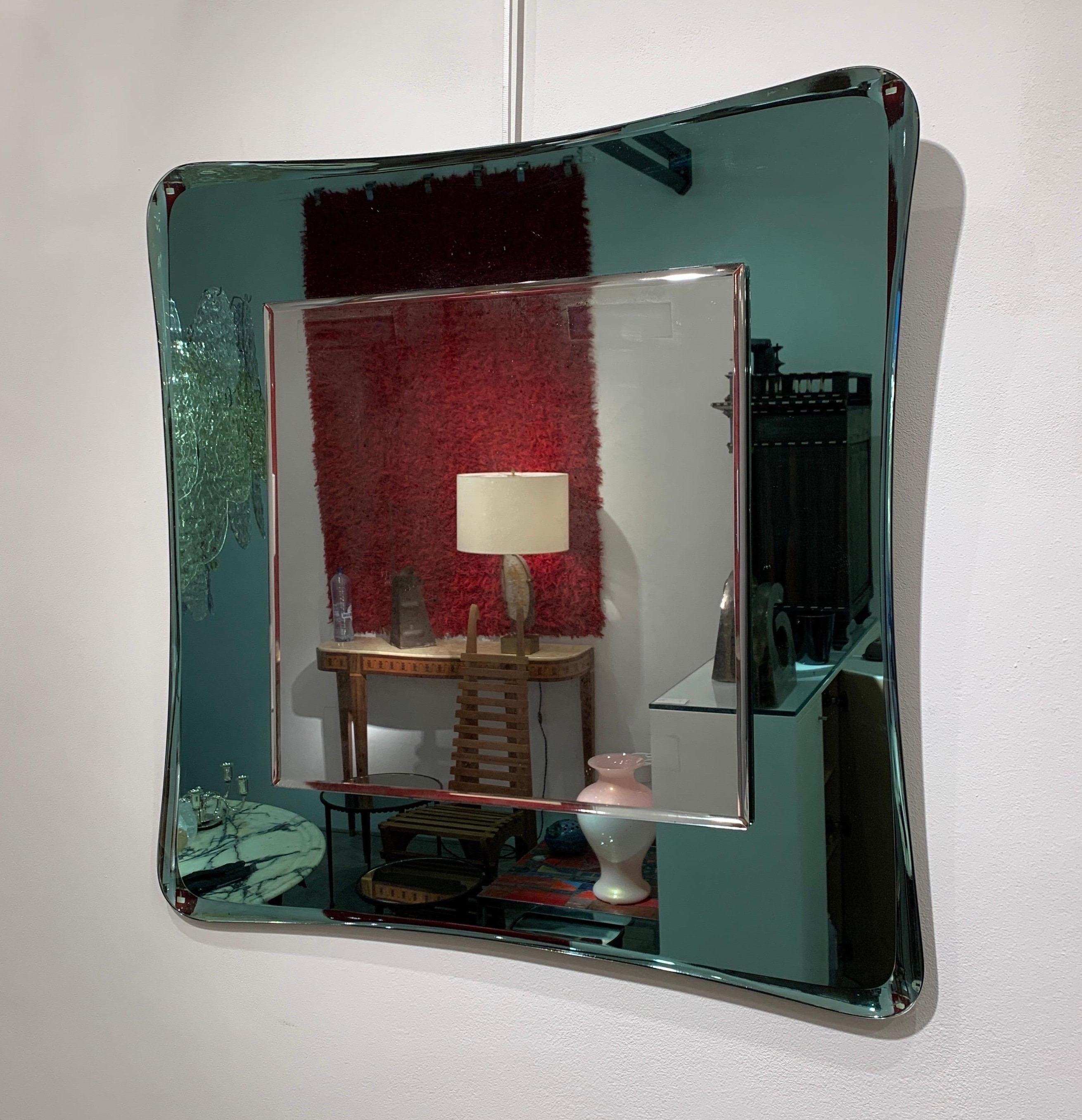 Cristal Arte was an important glassmaker from Torino active throughout the twentieth century. They designed quality pieces always with a beautiful decorative aspect. The light green colour is quite rare for this type of mirror.