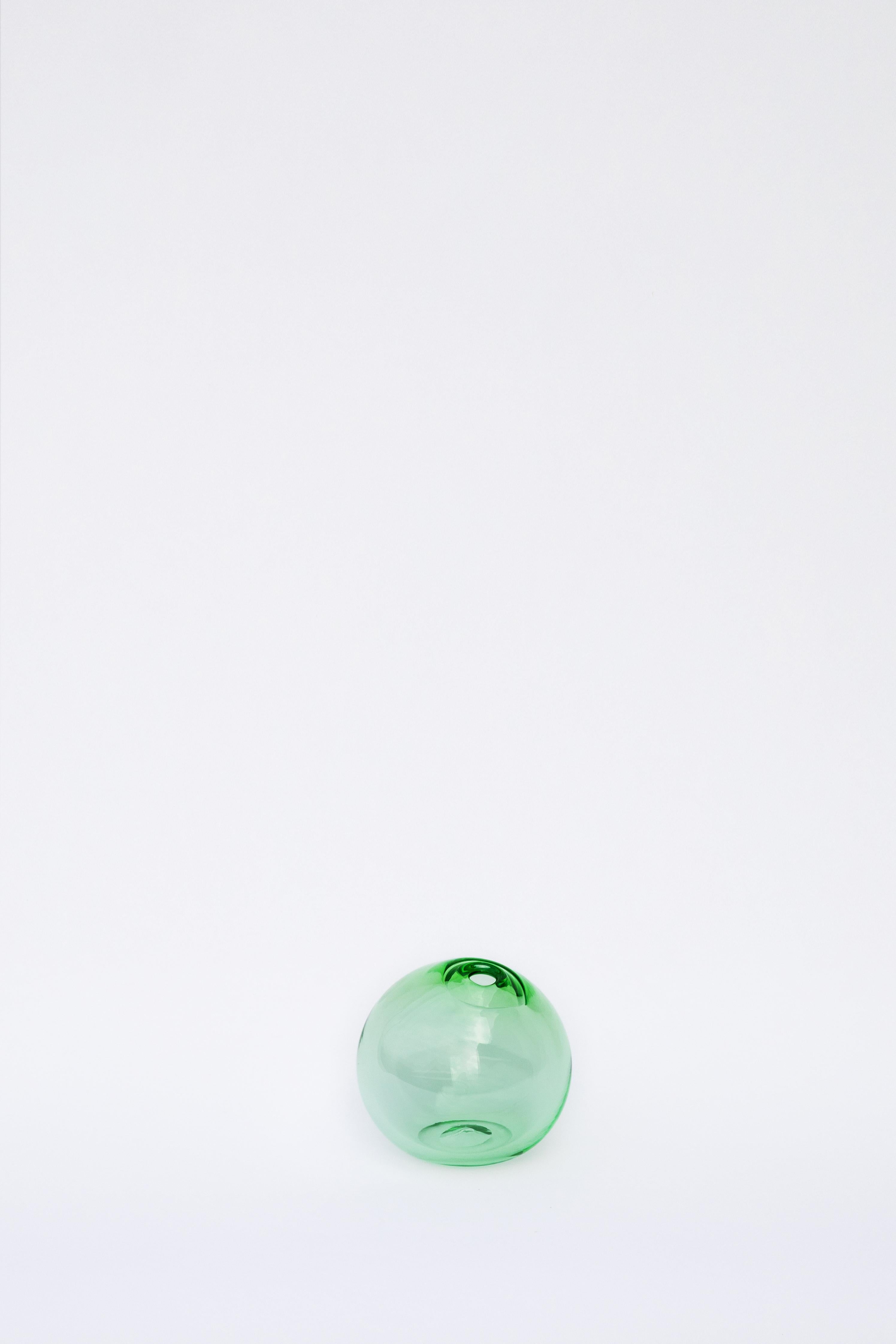 Light green float vessel 6 by SkLO
Dimensions: D 15 cm
Materials: Glass
Color: Light green
Available in 5 sizes: 15cm, 20cm, 30cm, 41cm, 51cm. Each size is available in 2 different colors.

Organic spheres of handblown Czech glass with broken