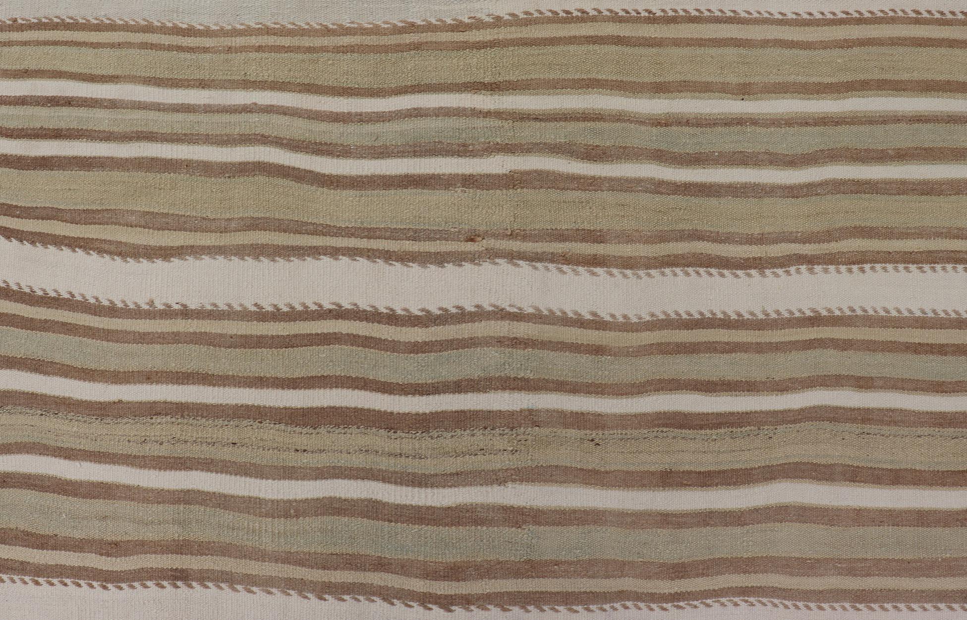 Striped Flat-Weave Vintage Turkish Kilim in Green, Cream, brown and Tan. Keivan Woven Arts / rug EN-15245, country of origin / type: Turkey / Kilim, circa 1950

Measures: 4'11 x 8'1 

This lightly-colored Turkish Kilim is flat-woven in a