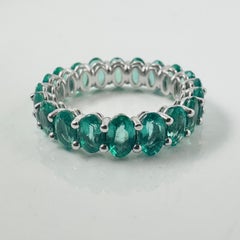 Light Green Oval Emerald Eternity Band in 18K White Gold, 4.38 Carats