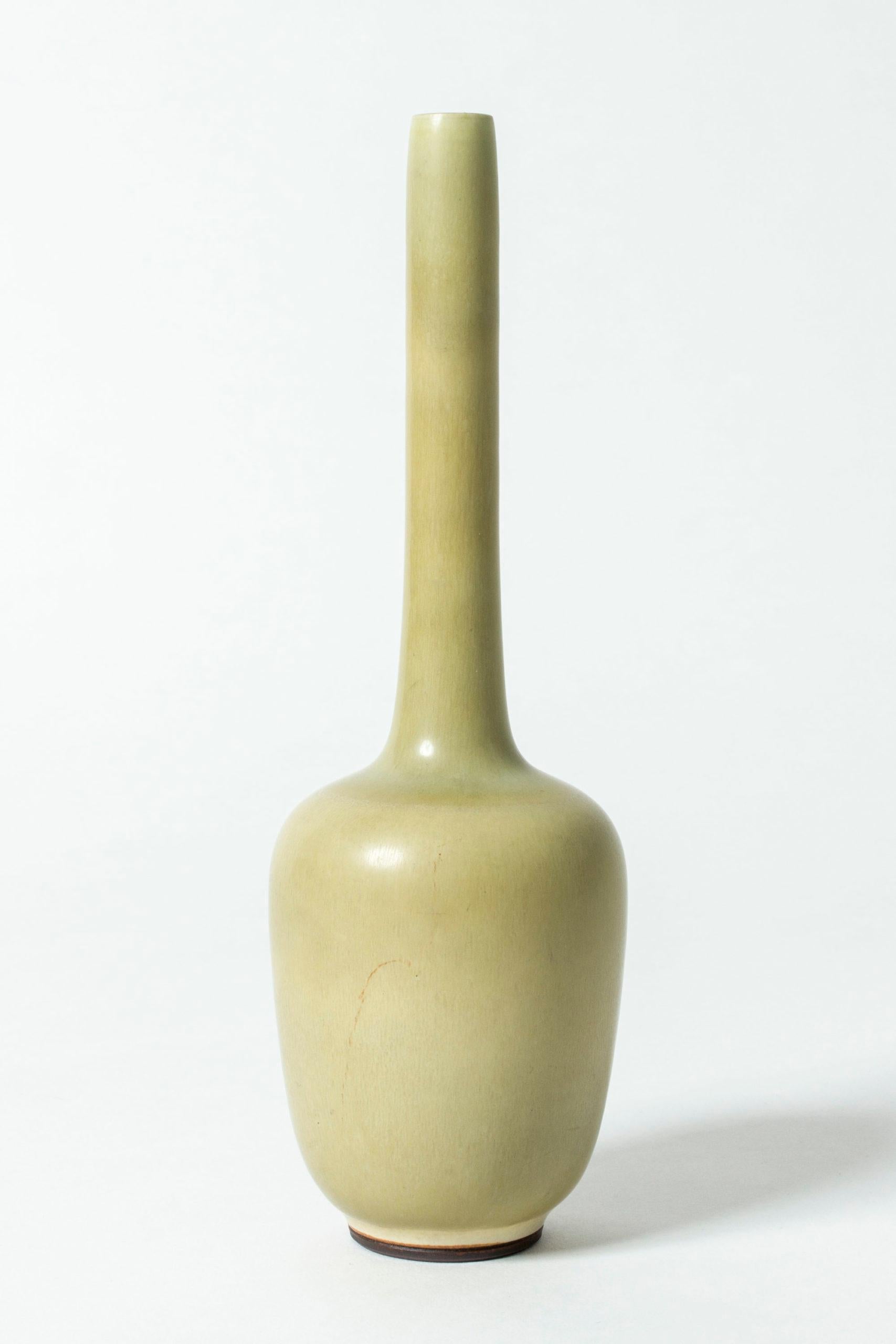 Stoneware vase by Berndt Friberg, in an interesting shape with an elongated, cylinder formed neck. Pale yellow hare’s fur glaze.


About Berndt Friberg: 
Berndt Friberg was a Swedish ceramicist, renowned for his stoneware vases and vessels for