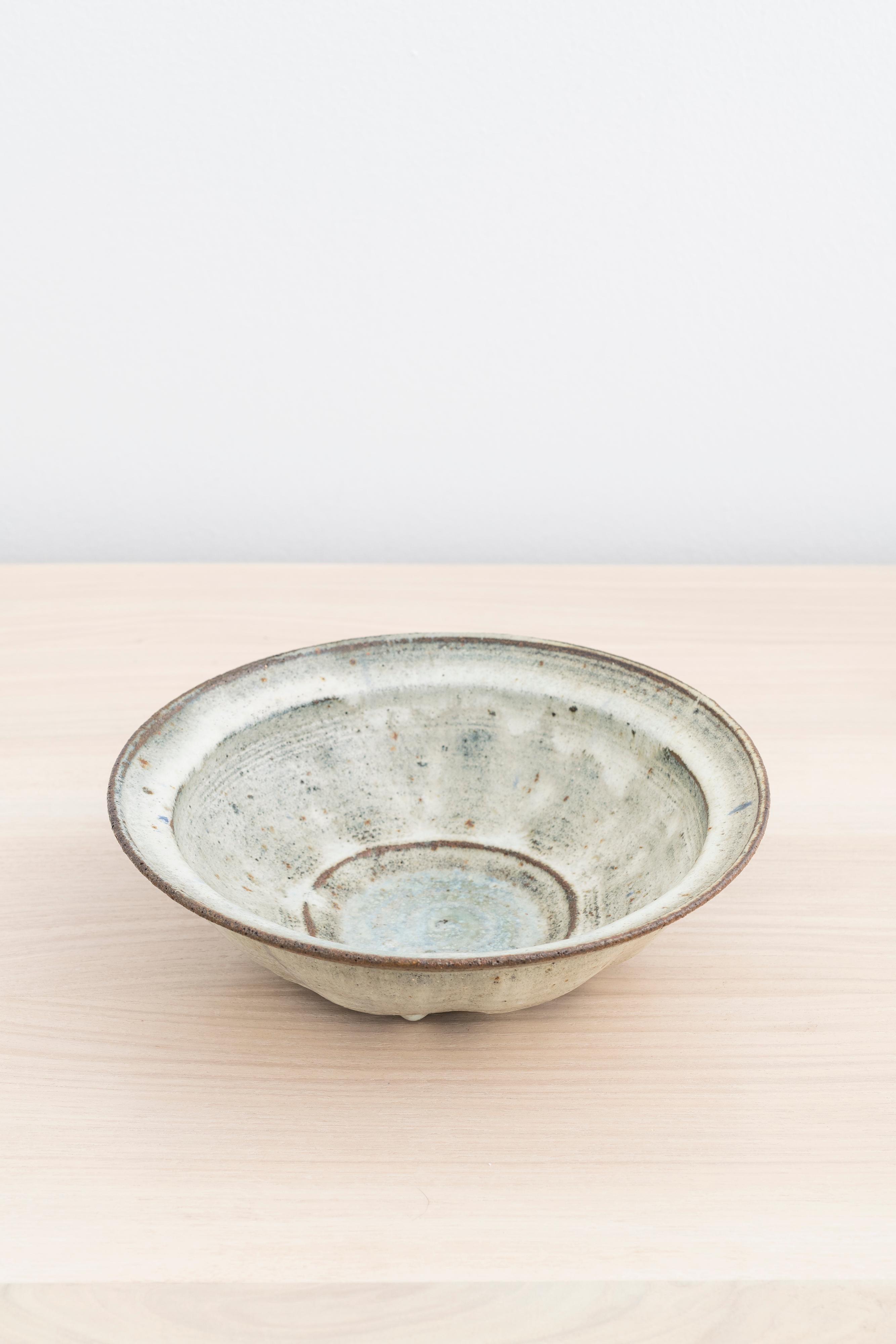 Unique stoneware bowl with light grey and blue glaze by Gutte Eriksen

Incised with 