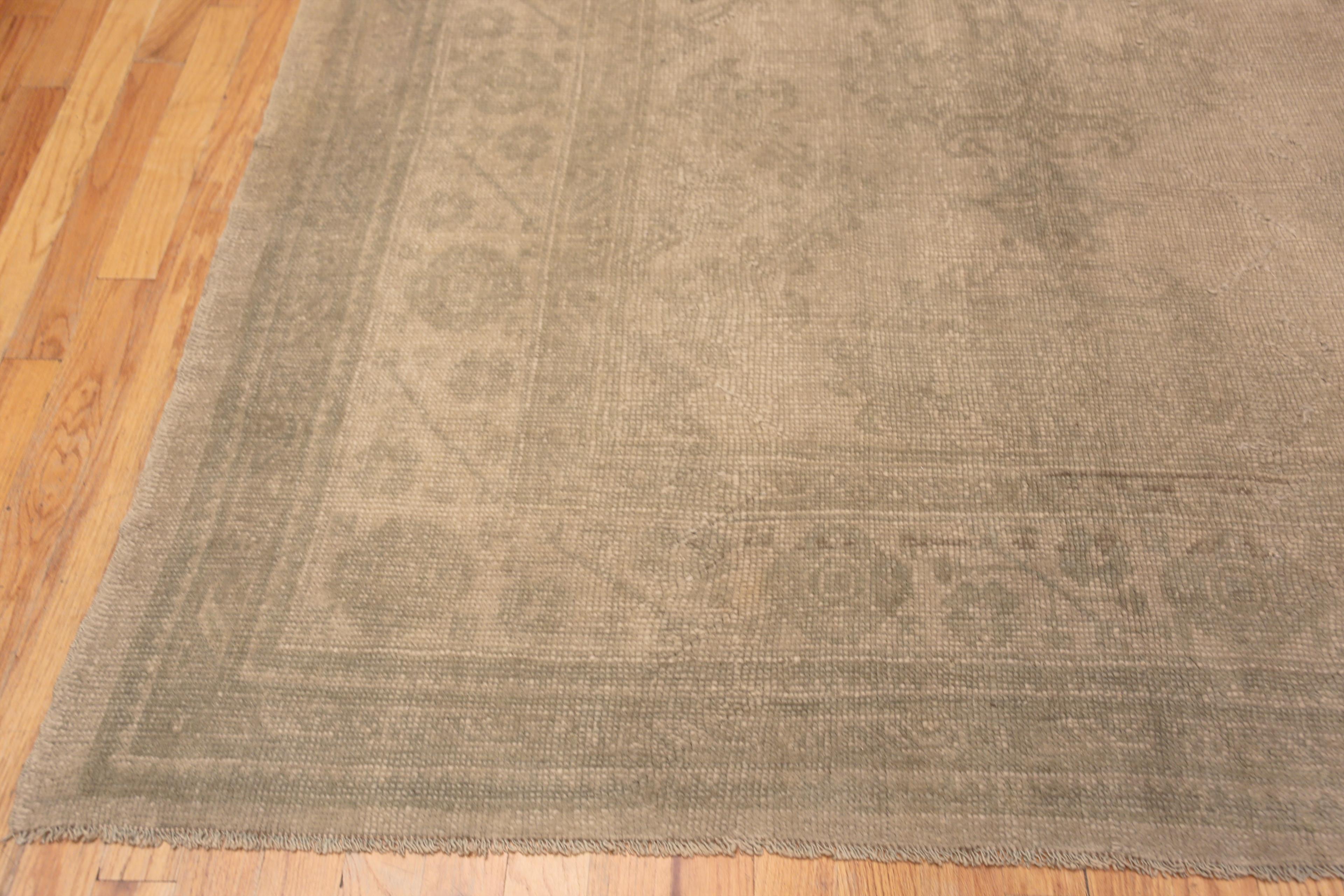 Soft and Decorative Large Size Light Grey Cream Color Tribal Design Antique Turkish Oushak Rug, Country of Origin / Rug Type: Antique Turkish Rug, Circa Date: 1920’s