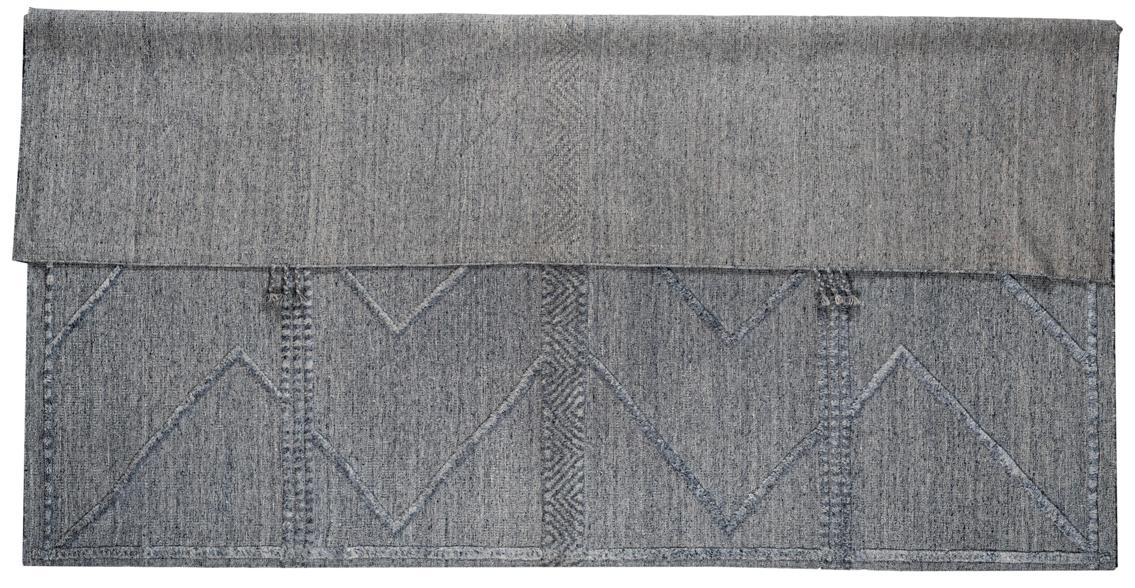 Coming from our newest collection of Moroccan designs, this 9x12 light grey and dark grey combination Moroccan design area rug is handmade and hand-knotted made in India. It has a cotton base and is made from all wool yarns. It features a