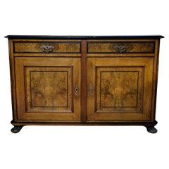 Antique Light mahogany sideboard with round legs from around the 1920s.