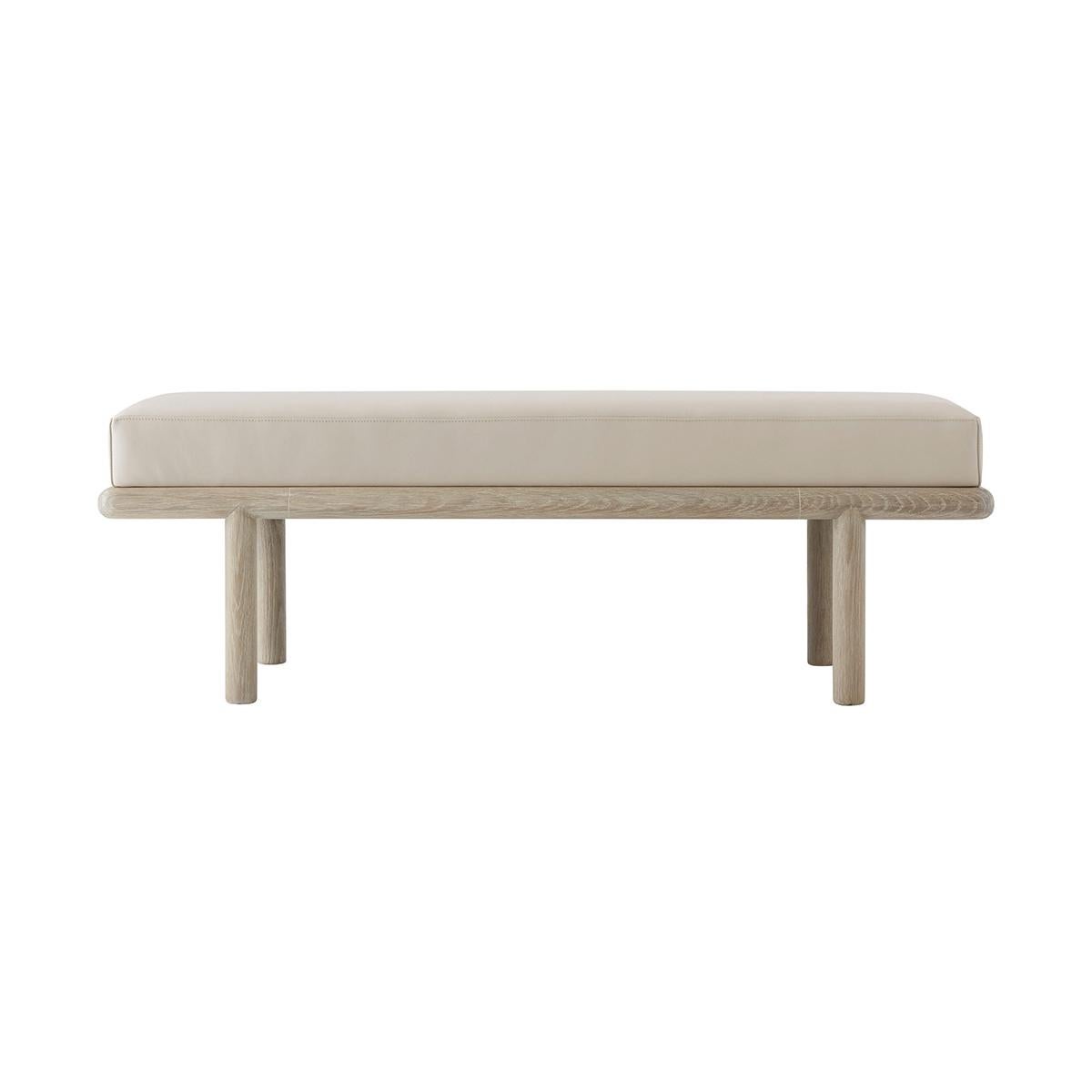 With a boxed leather upholstered cushion, the frame of this naturally designed upholstered bench is skillfully hand-finished with an intensive multi-step process, resulting in a beautifully brushed type of finish making the visible grain from the