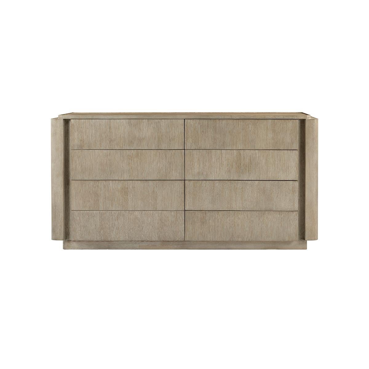 With a wire-brushed white oak in our light grey oak finish. This dresser is horizontally configured enabling it to not be an intrusive piece in the space and for the convenience of all who use it.

With eight drawers for ample storage and a lipped