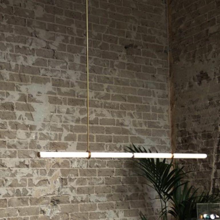Light object 015 by Naama Hofman
Dimensions: W 165, H 80 cm
Materials: Polished Brass
Light tube diameter 35 mm
Brass pipe diameter 10 mm
Canopy diameter 20 cm

Available lengths: 165 cm / 125 cm

Voltage: 110-240
CE Approved

Material: