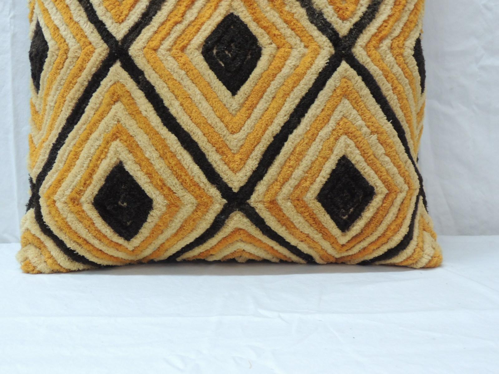 Light orange Raffia Velvet Kasai decorative pillow.
This graphic tribal pattern Kuba pillow is handcrafted in shades of dark orange and black. Intricately handwoven cut-pile by African tribe is backed with natural color linen. Decorative pillow