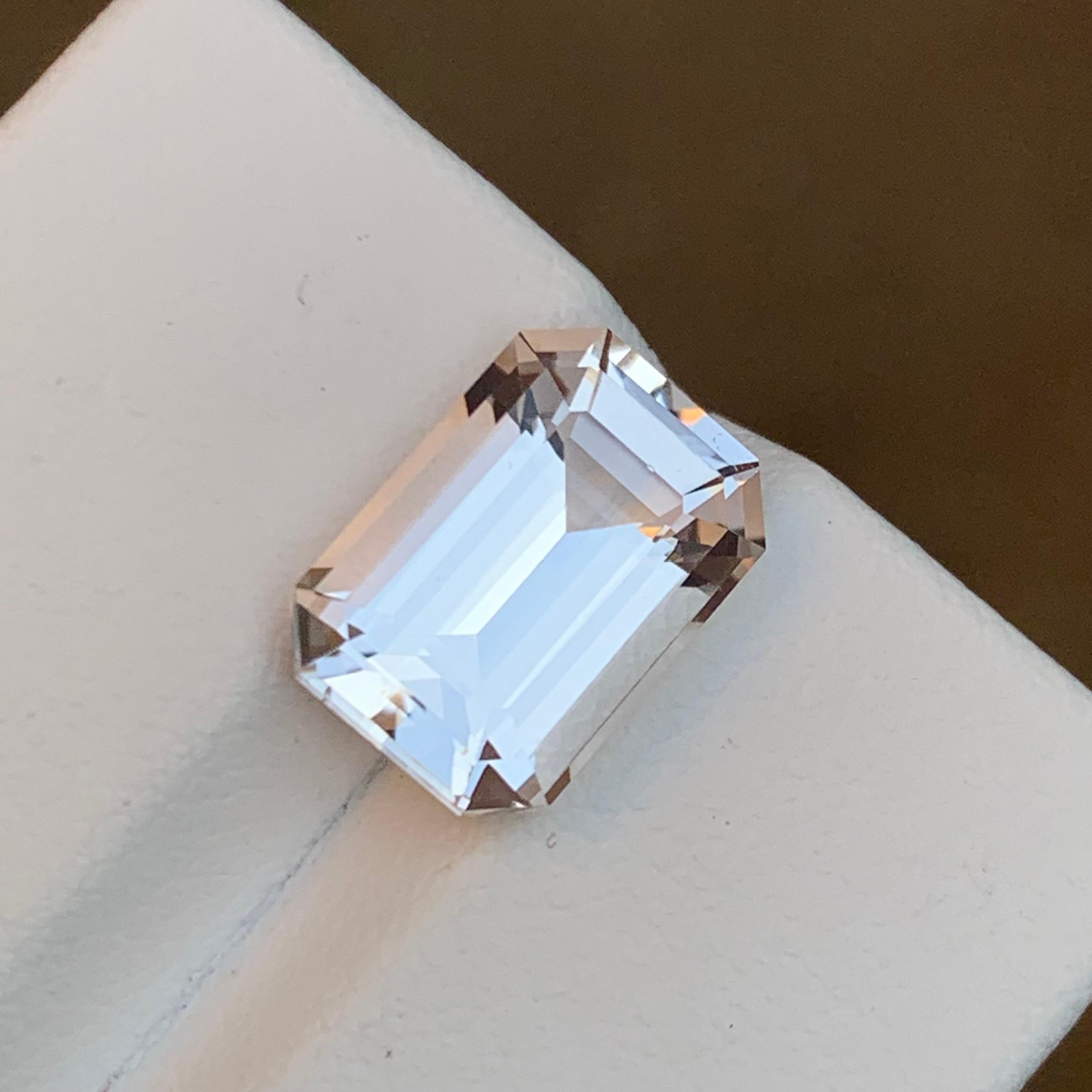 Elevate your style with this exquisite 4.60-carat Light Pastel Peach Natural Morganite, a rare gemstone sourced from Afghanistan. The Step Emerald Cut showcases its brilliance, while the gem's brilliant luster and eye-clean clarity add a touch of