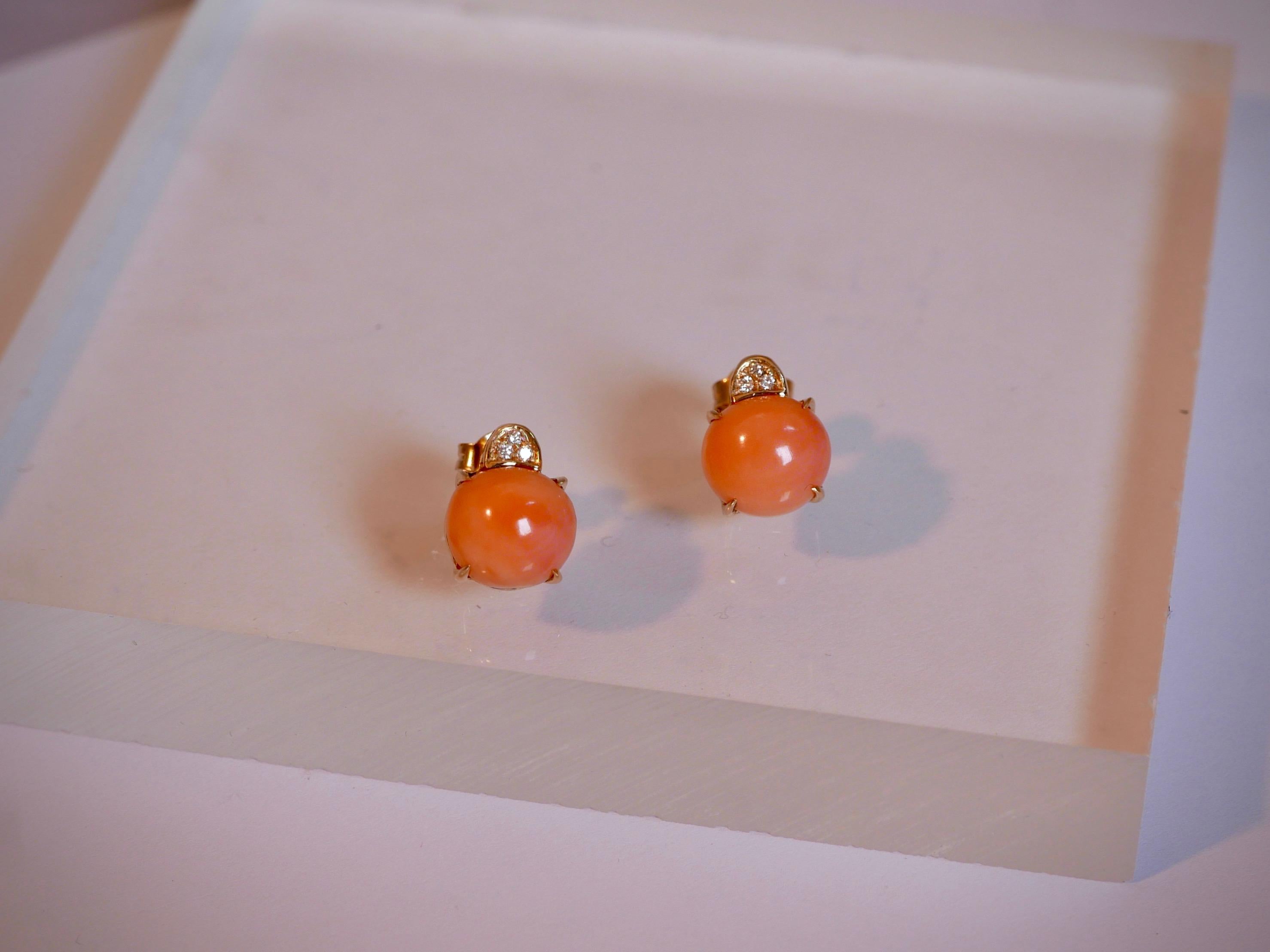 2 Handcut Coral stones (8,70ct)
Set with 6 White Diamonds (0,06ct) 
Set in 18kt White Gold
Made in Italy

These dainty earrings have been handmade in our 150 year old workshop in Italy. Our fifth generation goldsmith has cut them in house and set