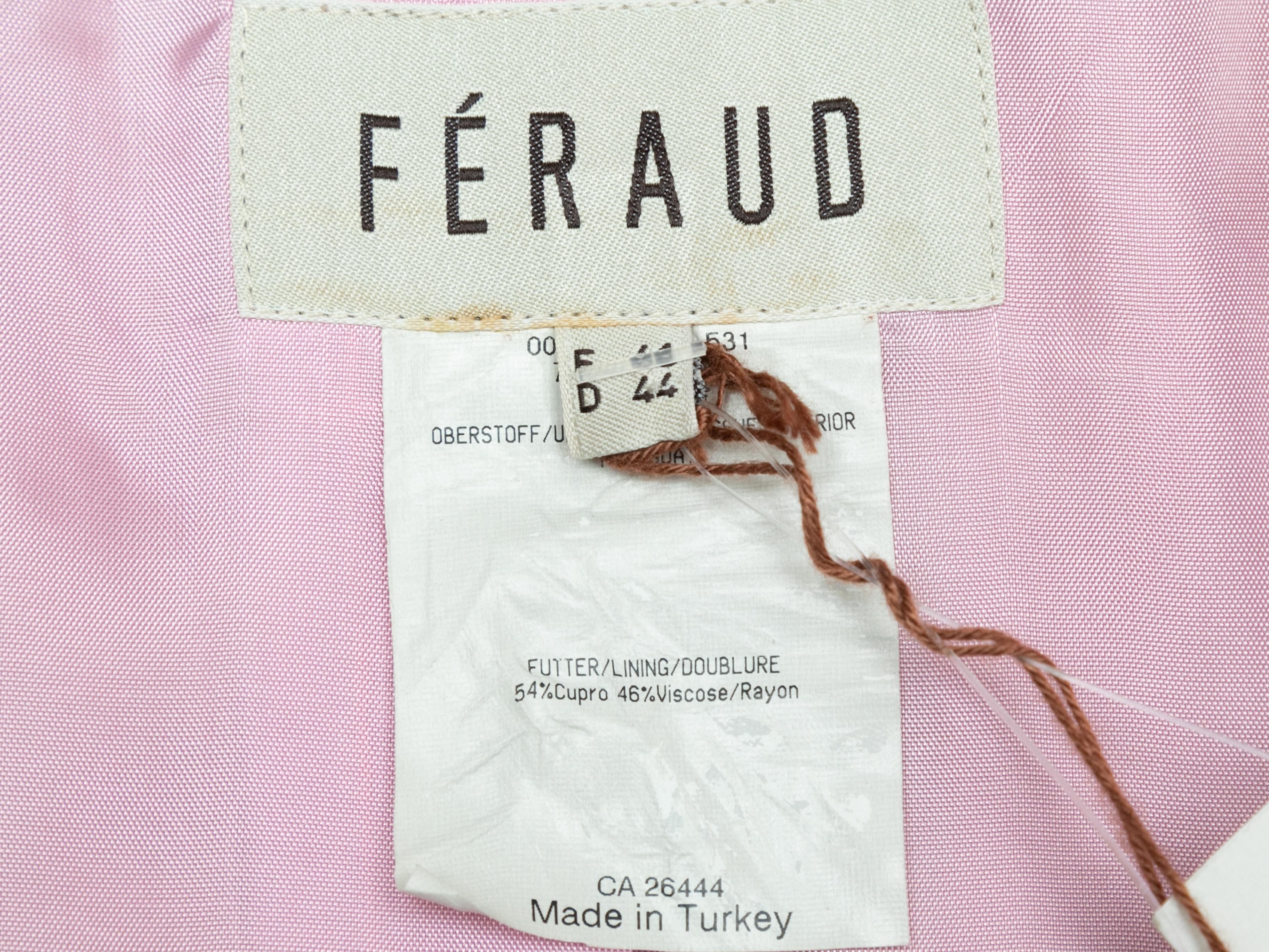 Light pink long suede coat by Louis Feraud. Notched collar. Dual flap pockets at hips. Front button closures. 23