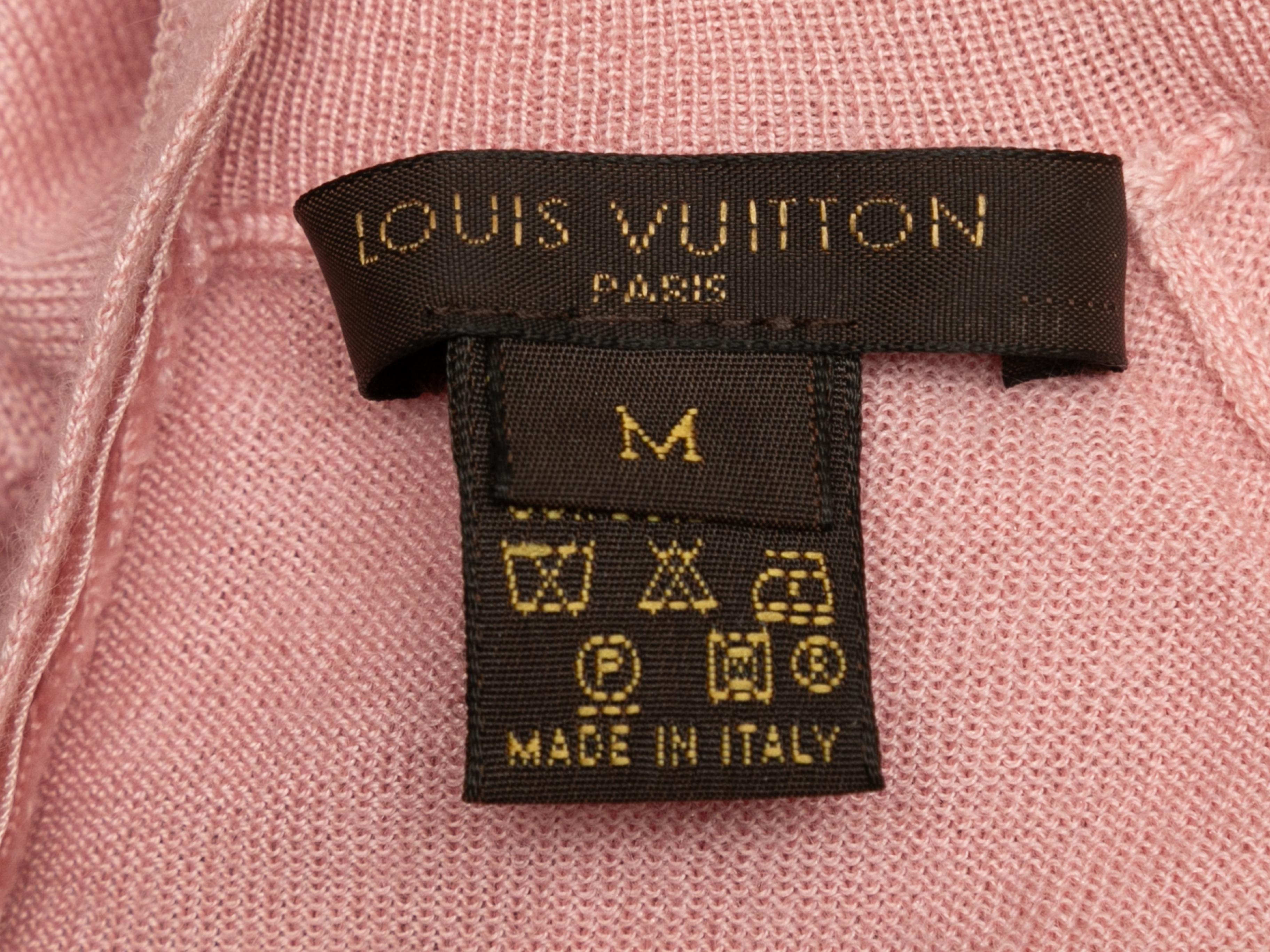 Light pink cashmere mock neck sweater by Louis Vuitton. Long sleeves. Zip closure at nape. 33