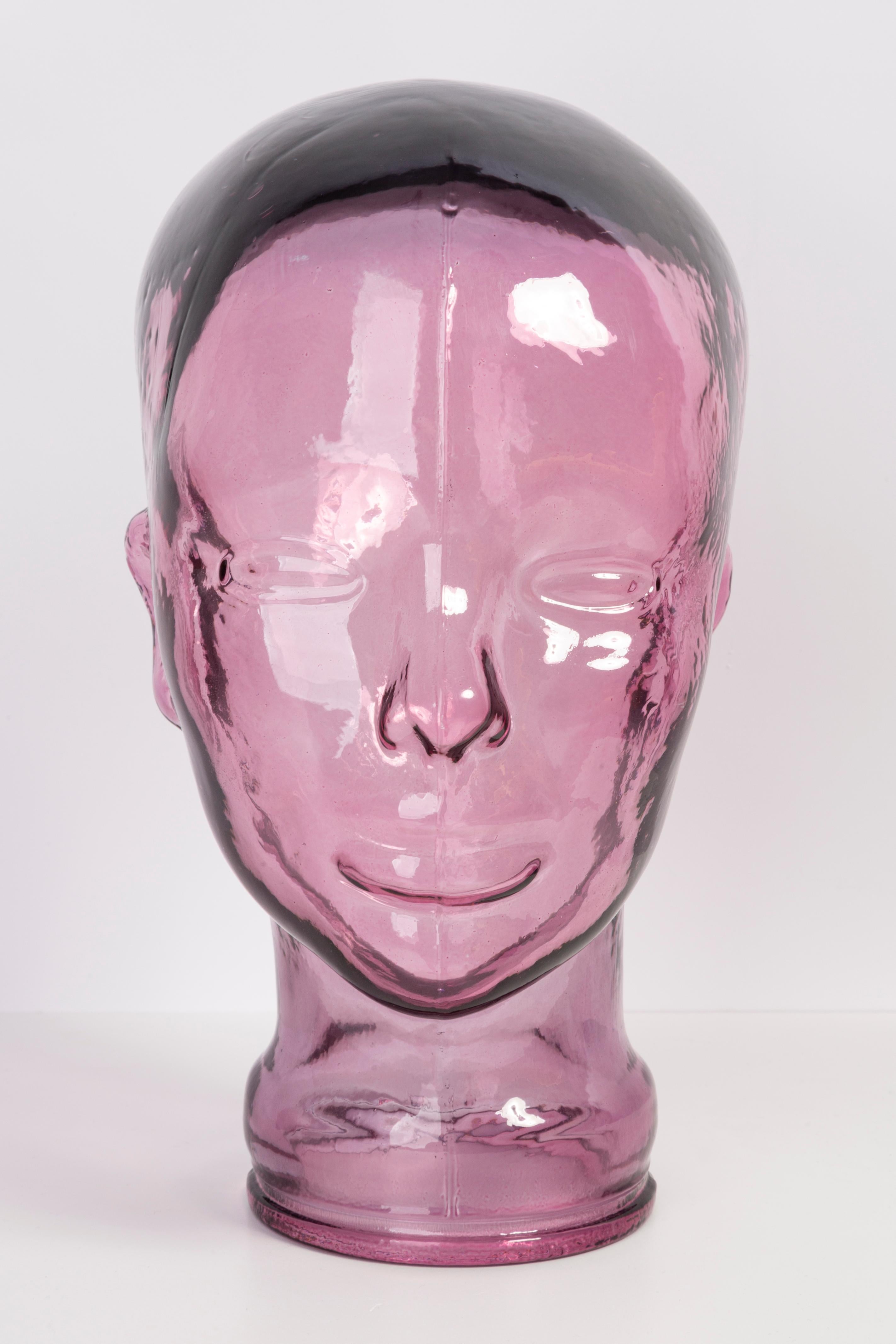 Life-size glass head in a unique light pink color. Produced in a German steelworks in the 1970s. Perfect condition. A perfect addition to the interior, photo prop, display or headphone stand.