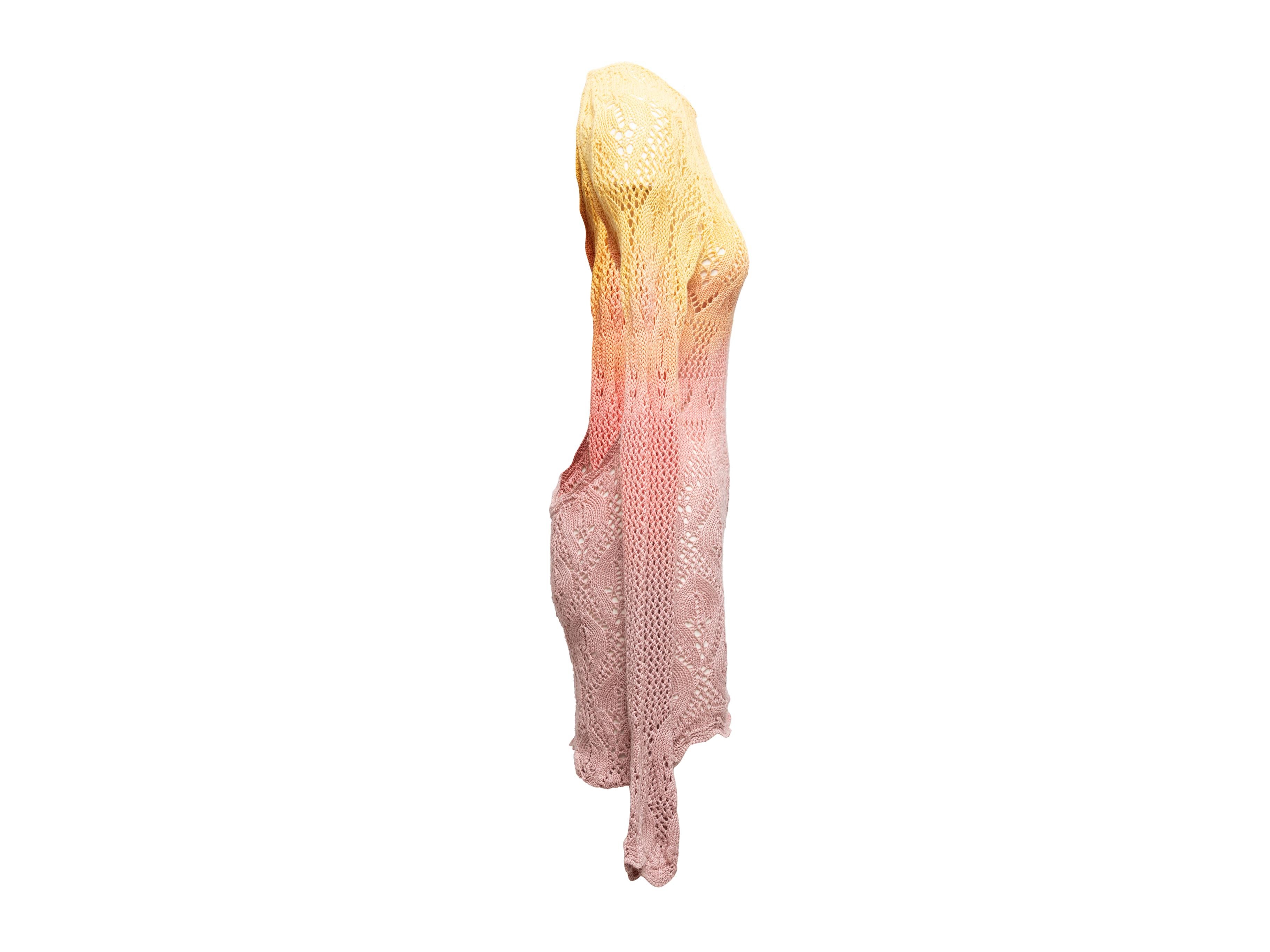 Product Details: Light pink and yellow open knit tie-dye dress by The Attico. Long sleeves. Crew neck. Open back. 31