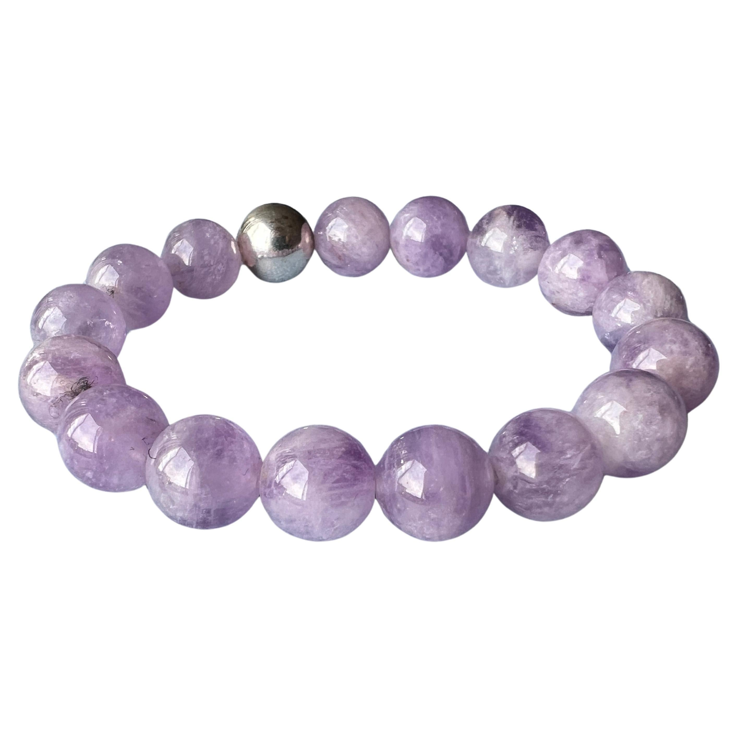 Amethyst Semi Precious Bead Armband in Silber, Licht lila, Unisex, Kronenchakra Unterstützung

Beschreibung:
Unisex-Armband aus hellvioletten Amethyst-Halbperlen mit silberfarbenen Verzierungen. Der Amethyst ist für seine beruhigenden und spirituell
