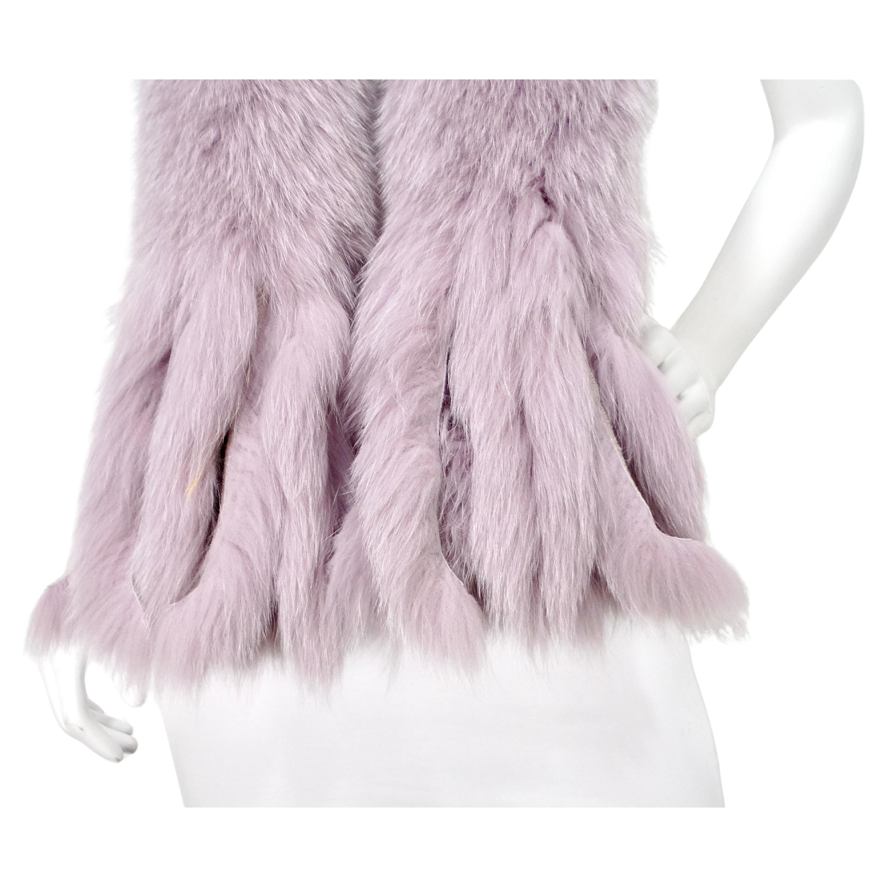 The Light Purple Fox Fur Fringe Stole Scarf is a luxurious accessory that exudes elegance and sophistication. Crafted from the softest, high-quality fox fur, it features a delicate light purple hue that adds a touch of femininity and modern flair.