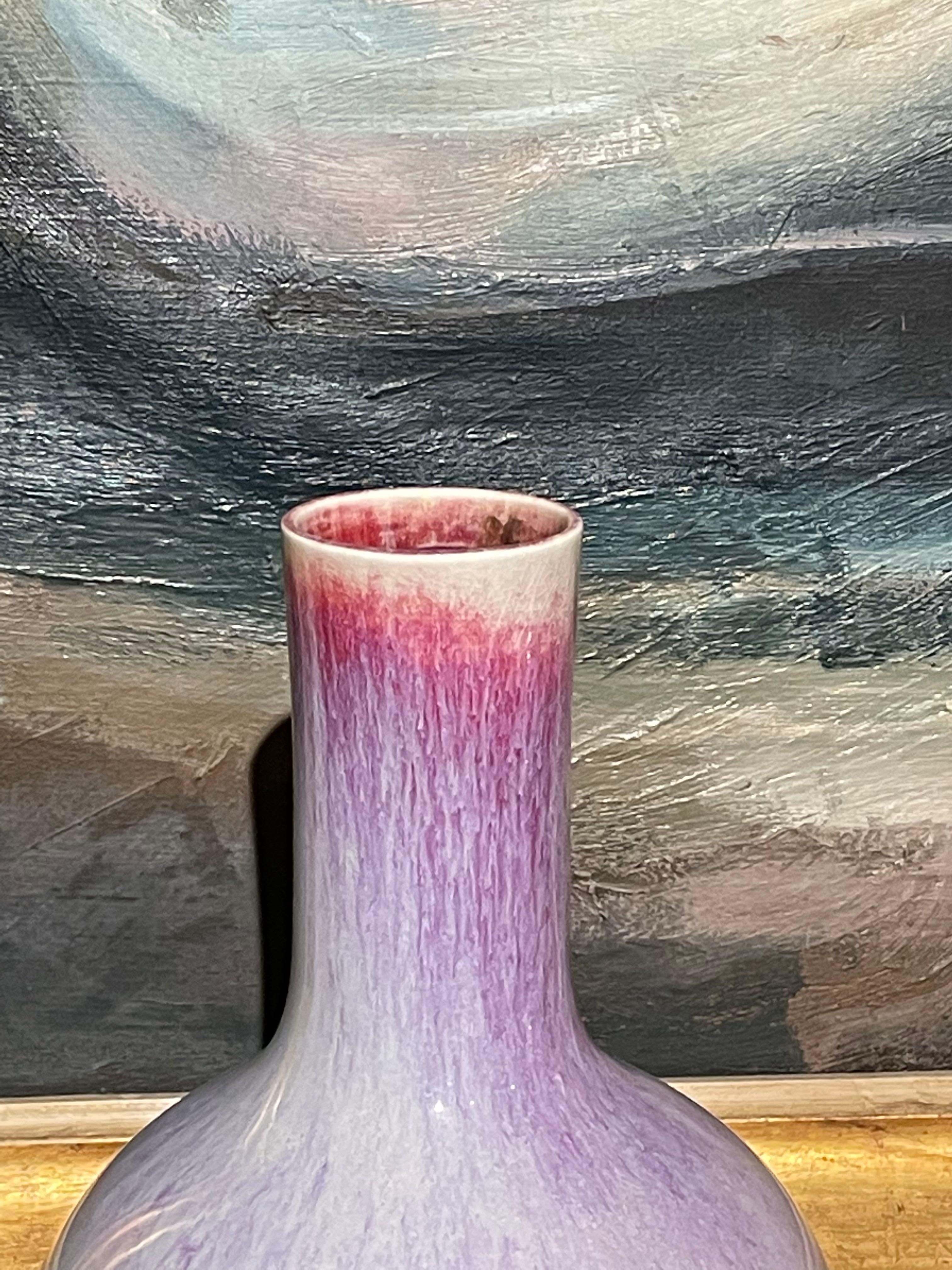 Contemporary Chinese mottled pale purple glazed ceramic vase.
Tall, thin neck design.
One of a large collection.
Two available and sold individually.
