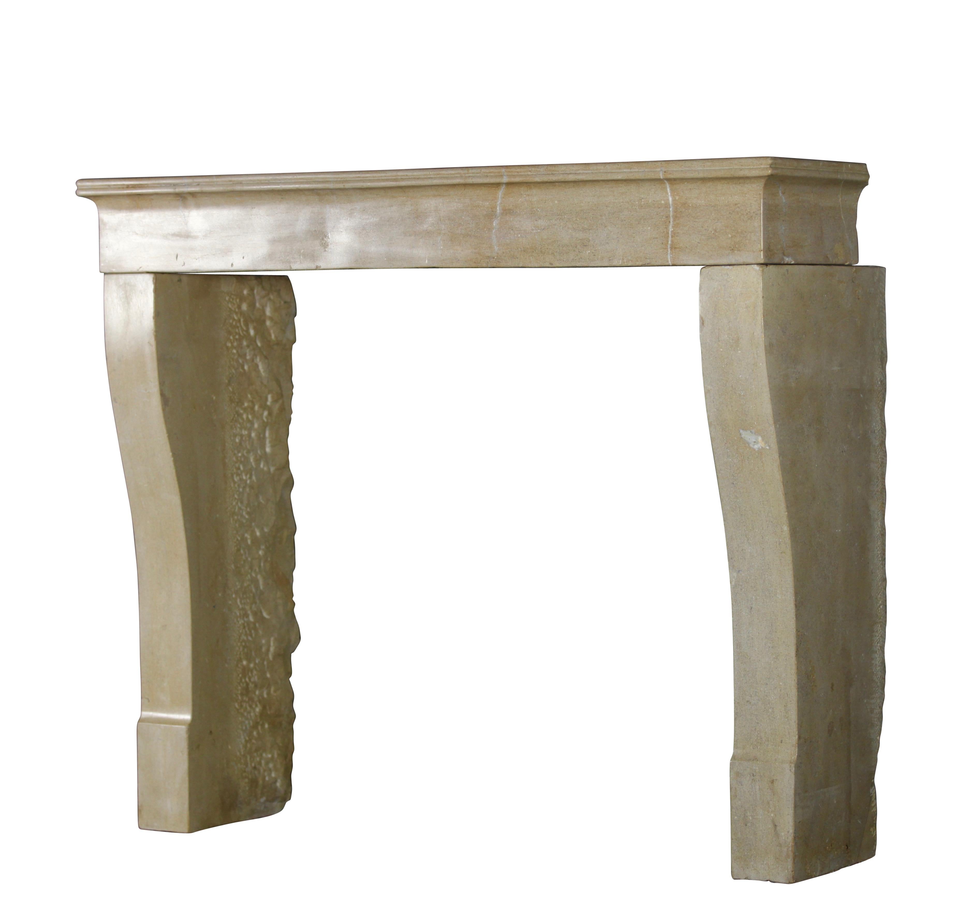 A fine 19th century French petite Bourguignon original hard stone/limestone fireplace surround. Elegant and small for a timeless minimalistic interior with a smooth surface. 
Measures:
120 cm exterior width 47.24 inch
102 cm exterior height 40.15