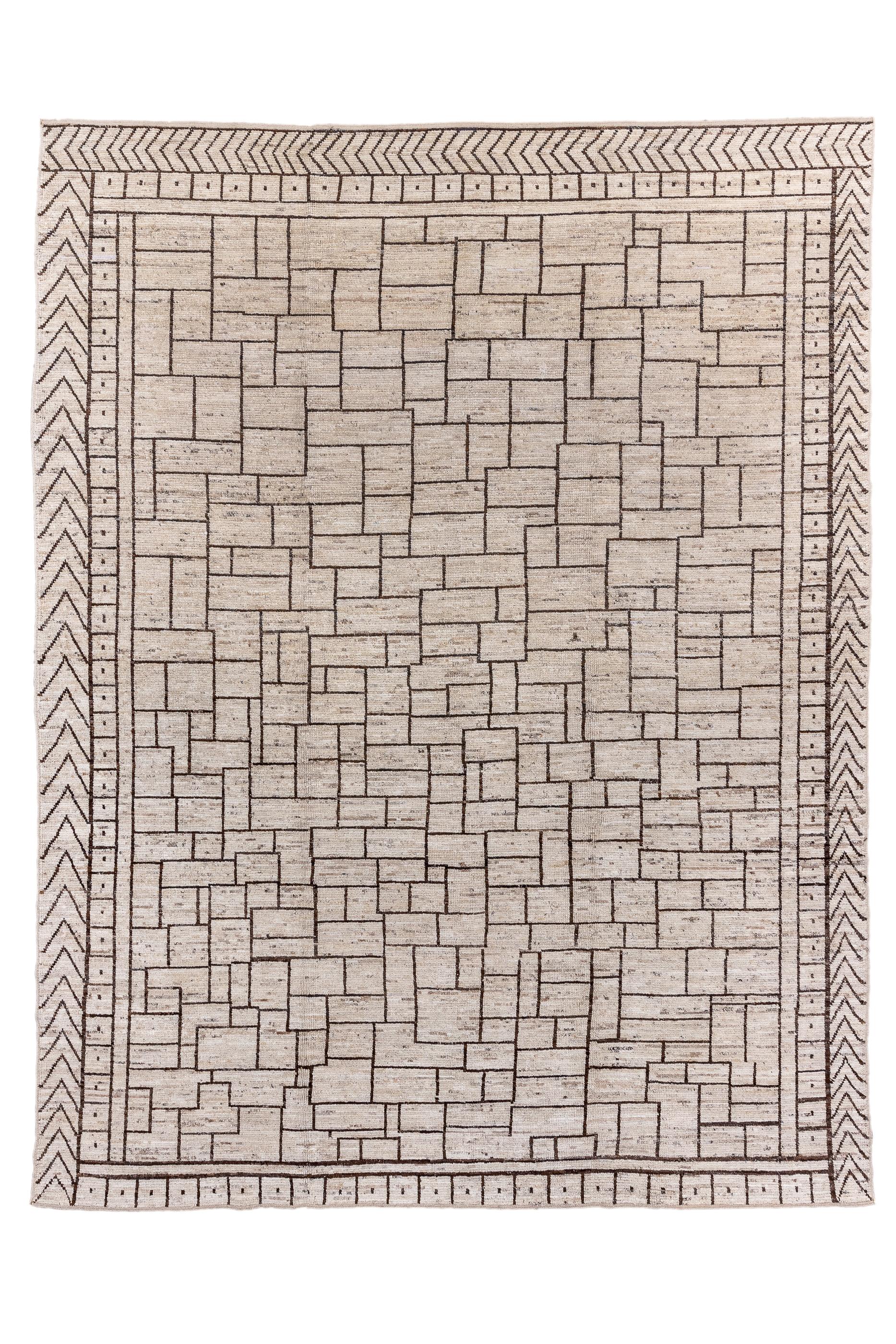 Room size Tulus are a recent innovation. Here the abrashed natural light tan field supports an allover, irregular brick, cracked ice pattern delineated in dark brown. The borders continue the palette but show a more regular inner band of equal