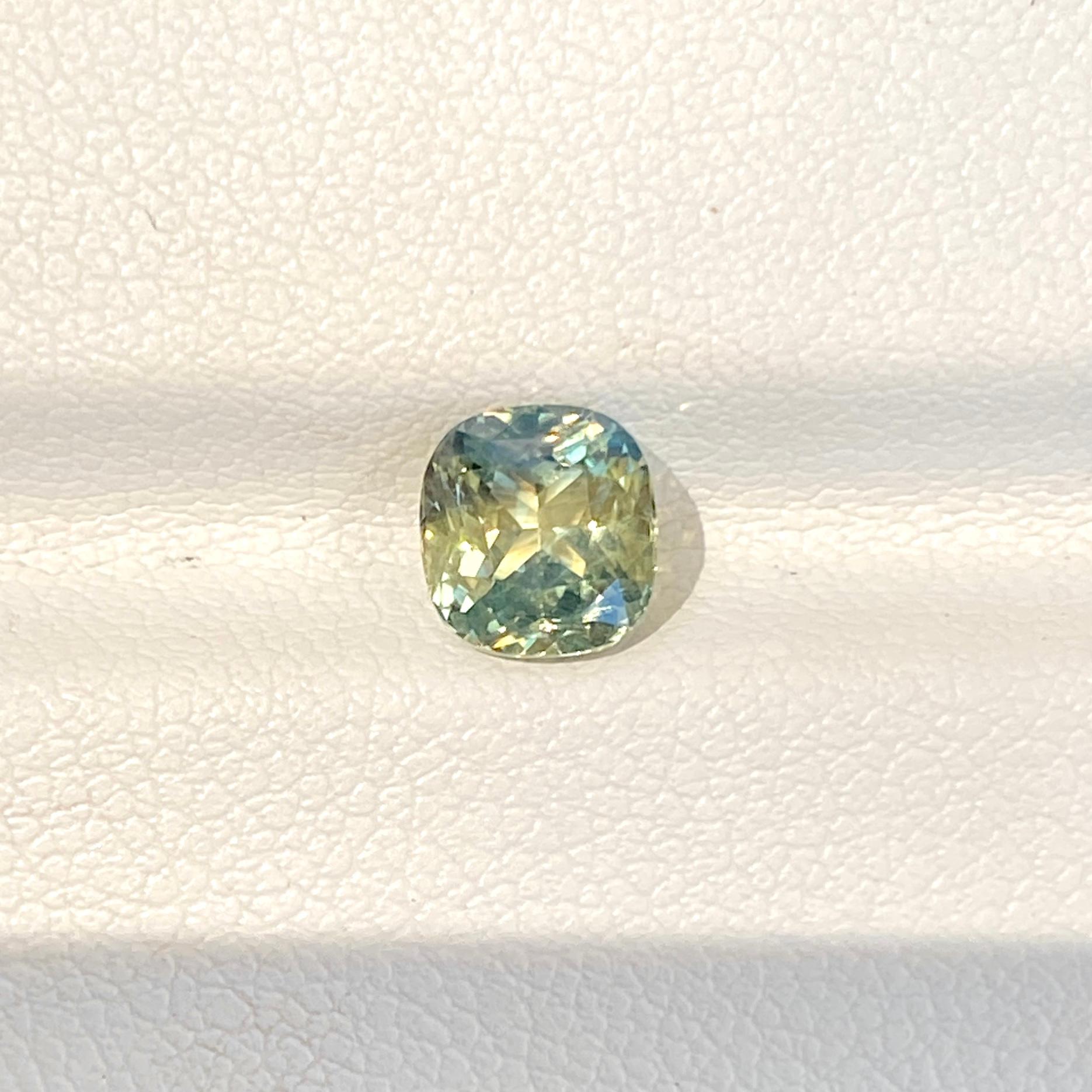 Soft rounded corners on this cushion cut light teal parti sapphire offers an attractive option for a custom made jewel of your choice. Bright minty pops of lime and yellow colour glisten from this charismatic natural unheated light teal