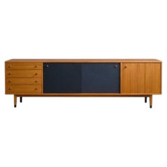 Light wood sideboard with contrasting black panels
