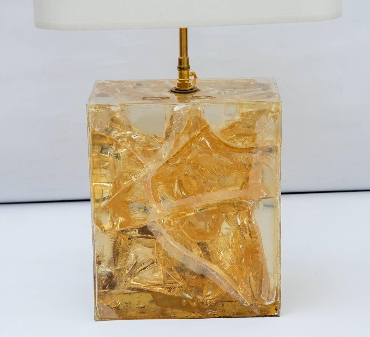 Brick shaped table lamp made of a resin fractal block in faded yellow colour and new brass neck.
   