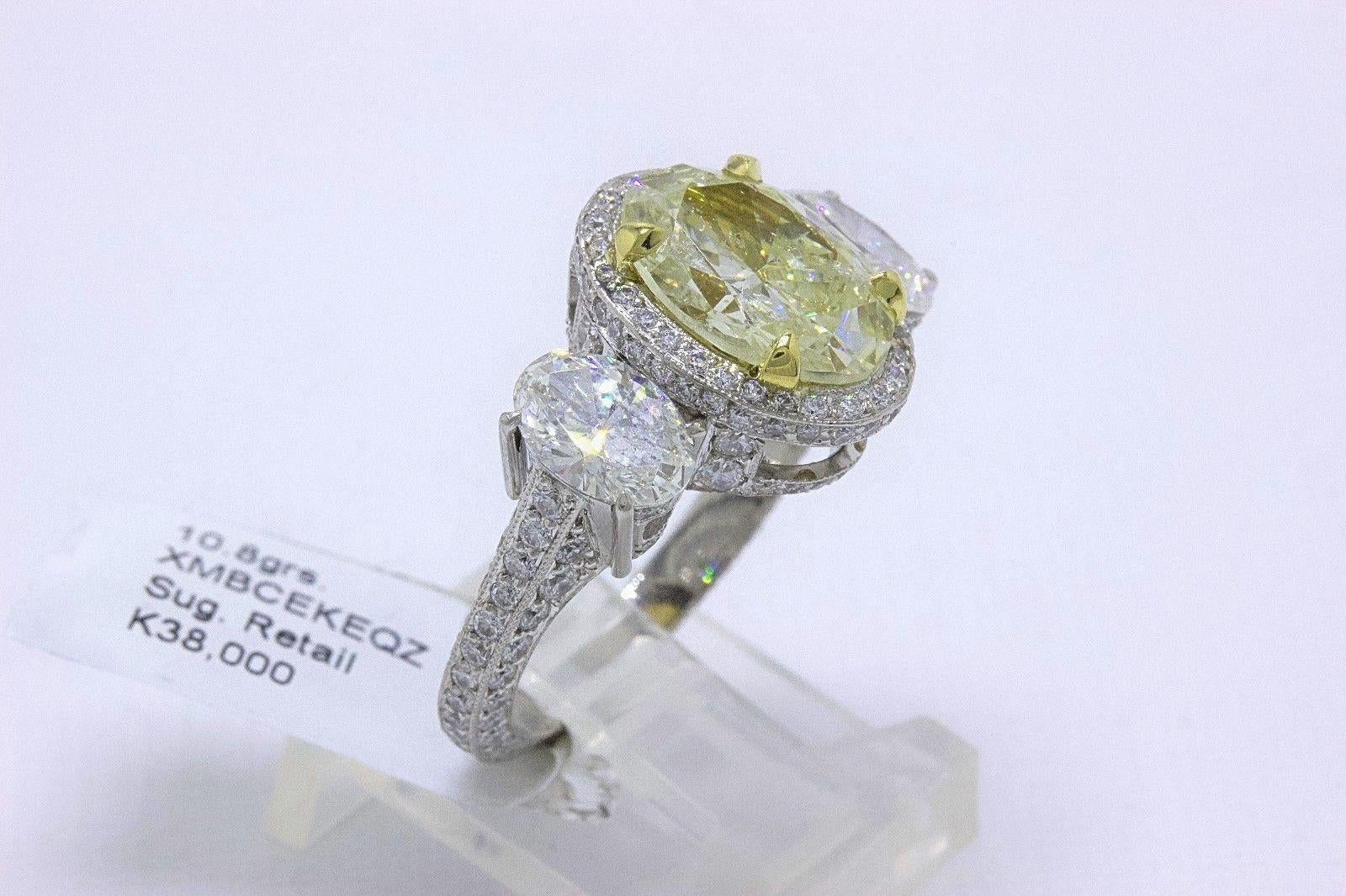 Light Yellow Oval Diamond Three-Stone Engagement Ring 6.44 Carat SI2 in Platinum 6