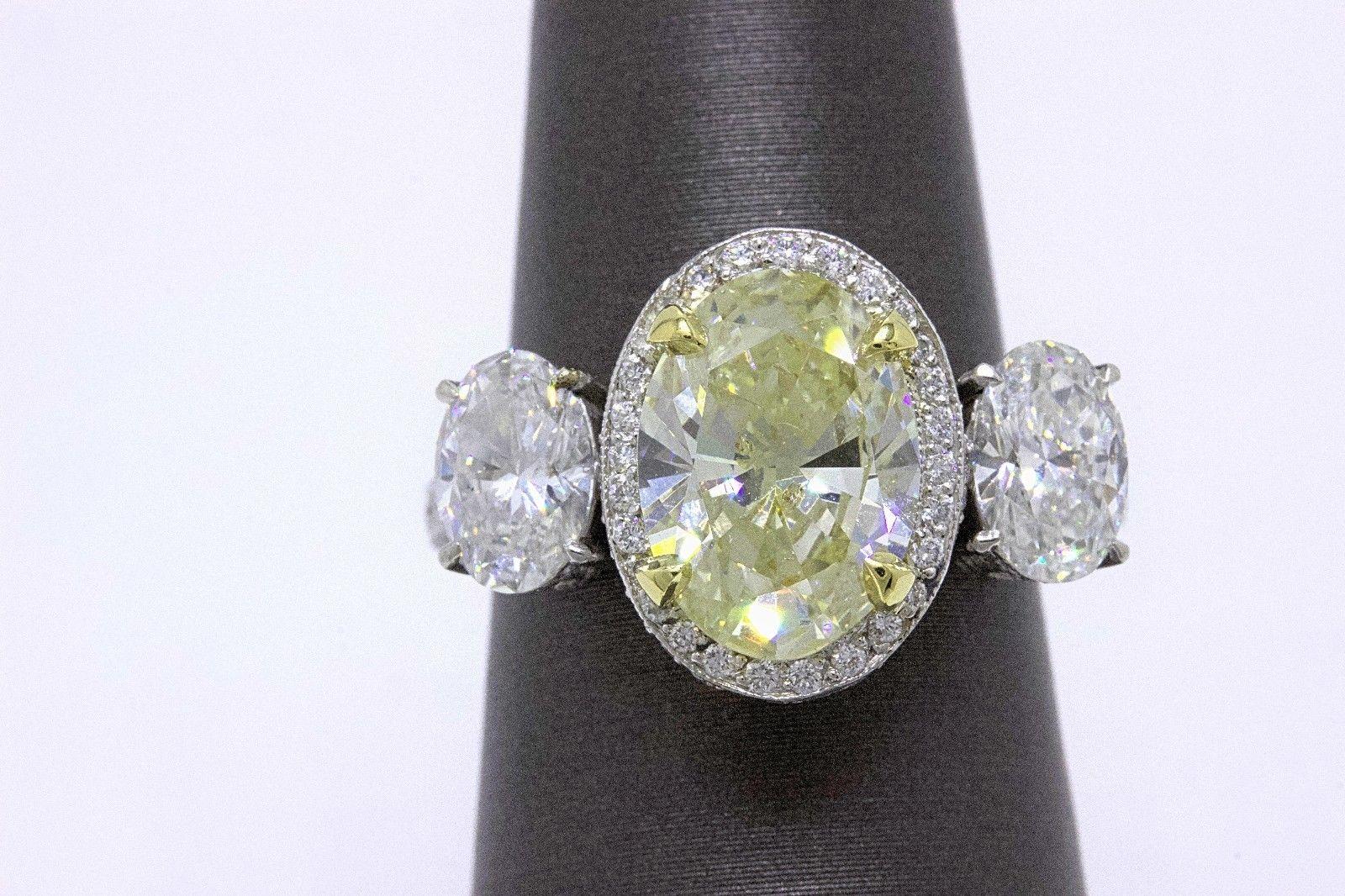 Oval Cut Light Yellow Oval Diamond Three-Stone Engagement Ring 6.44 Carat SI2 in Platinum
