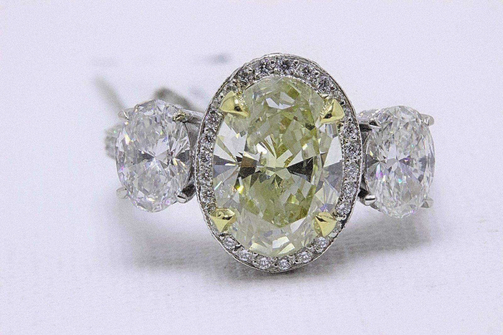 Light Yellow Oval Diamond Three-Stone Engagement Ring 6.44 Carat SI2 in Platinum 4