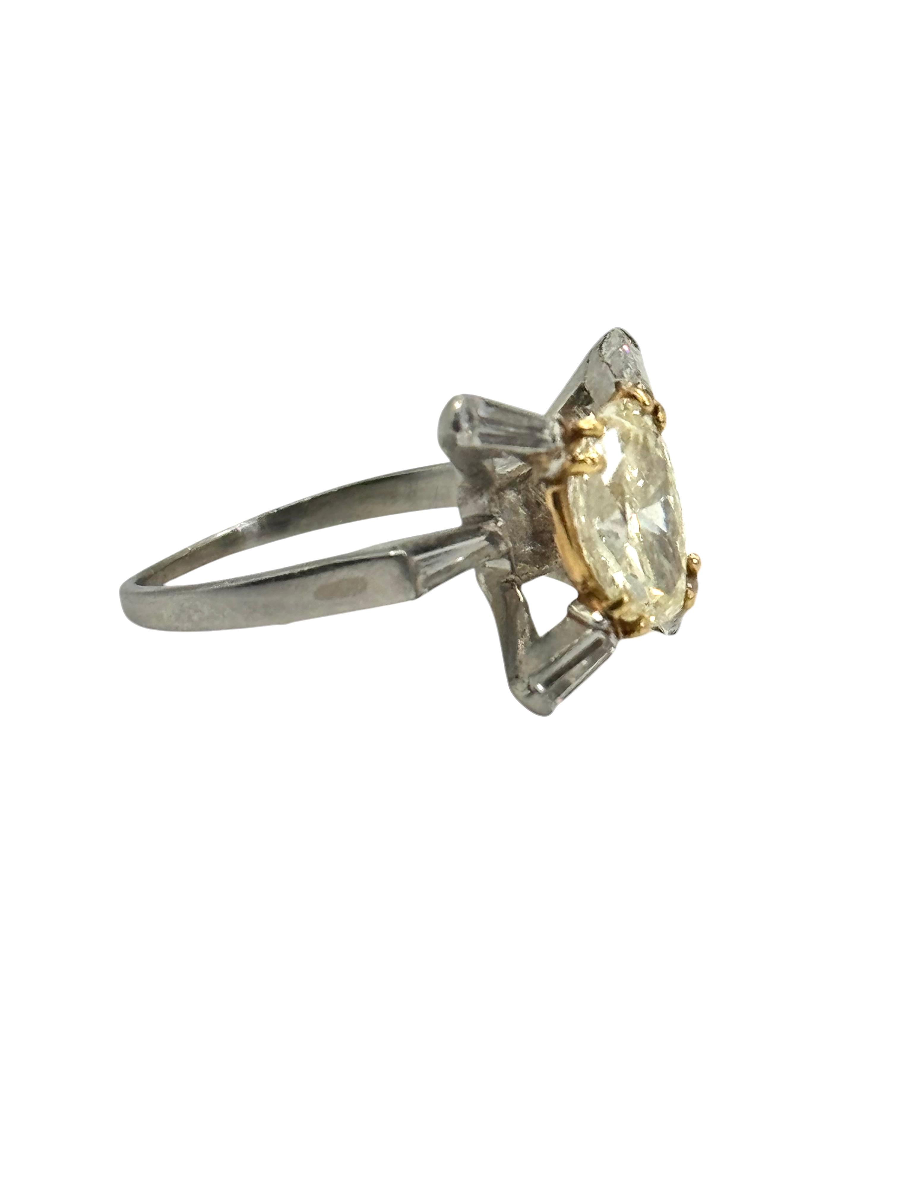 Light Yellow VVS2 Diamond Ring Oval diamond approximately 1.56 carats, bagguetes approximately .70 carat. Platinum and 18K Gold