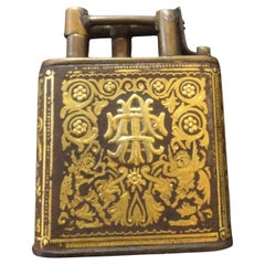 Lighter with lifting arm in bronze and gold damascening on iron.