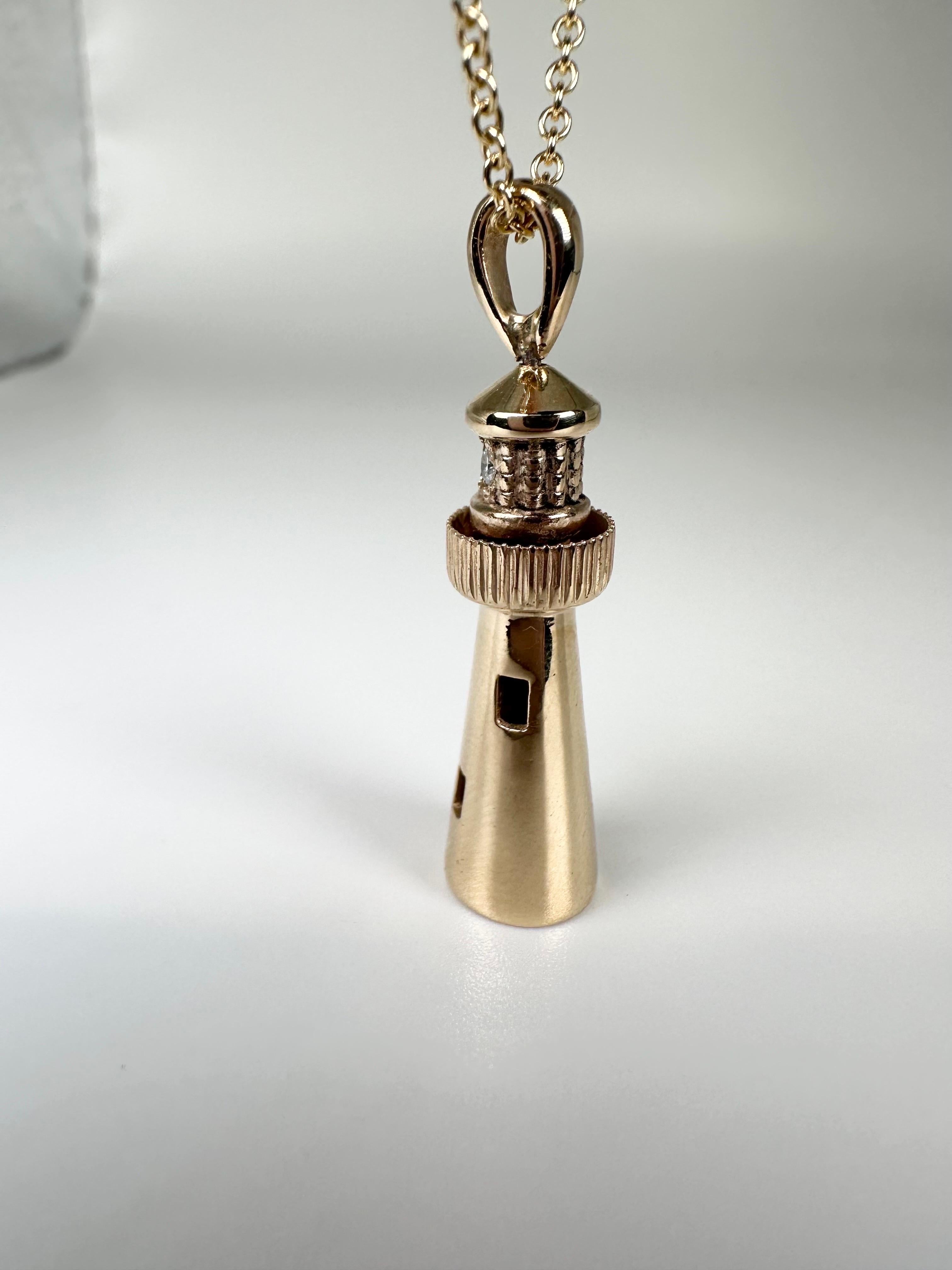 Stunning signature lighthouse pendant in 14KT yellow gold made with natural diamond. The pendant is a moving pendant on the top, it moves around in circle, its a very unique pendant 28mm long. The inspiration came from our beautiful anf famous